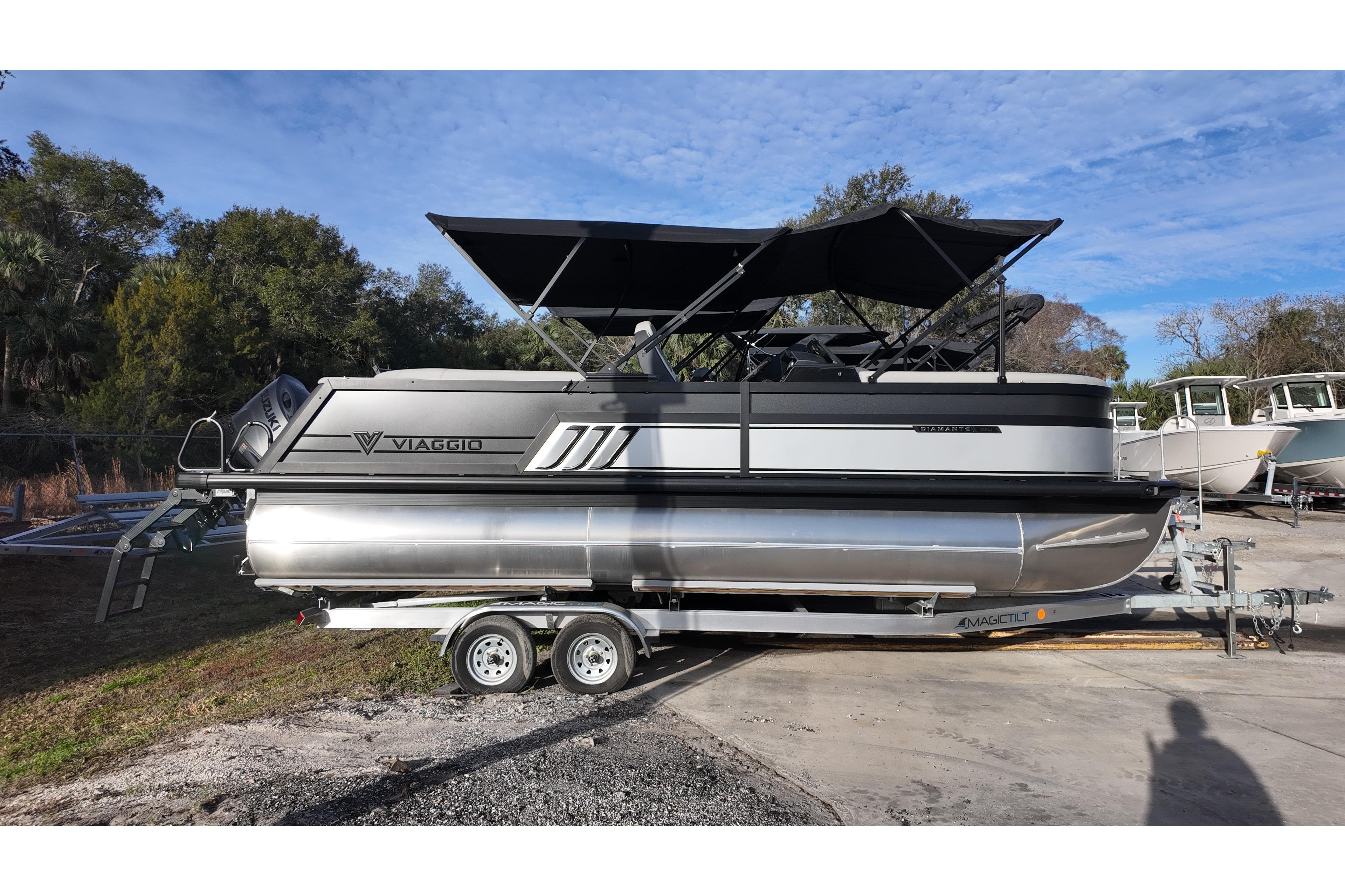 2026 Viaggio Diamante D22U pontoon boat on trailer, parked outdoors.
