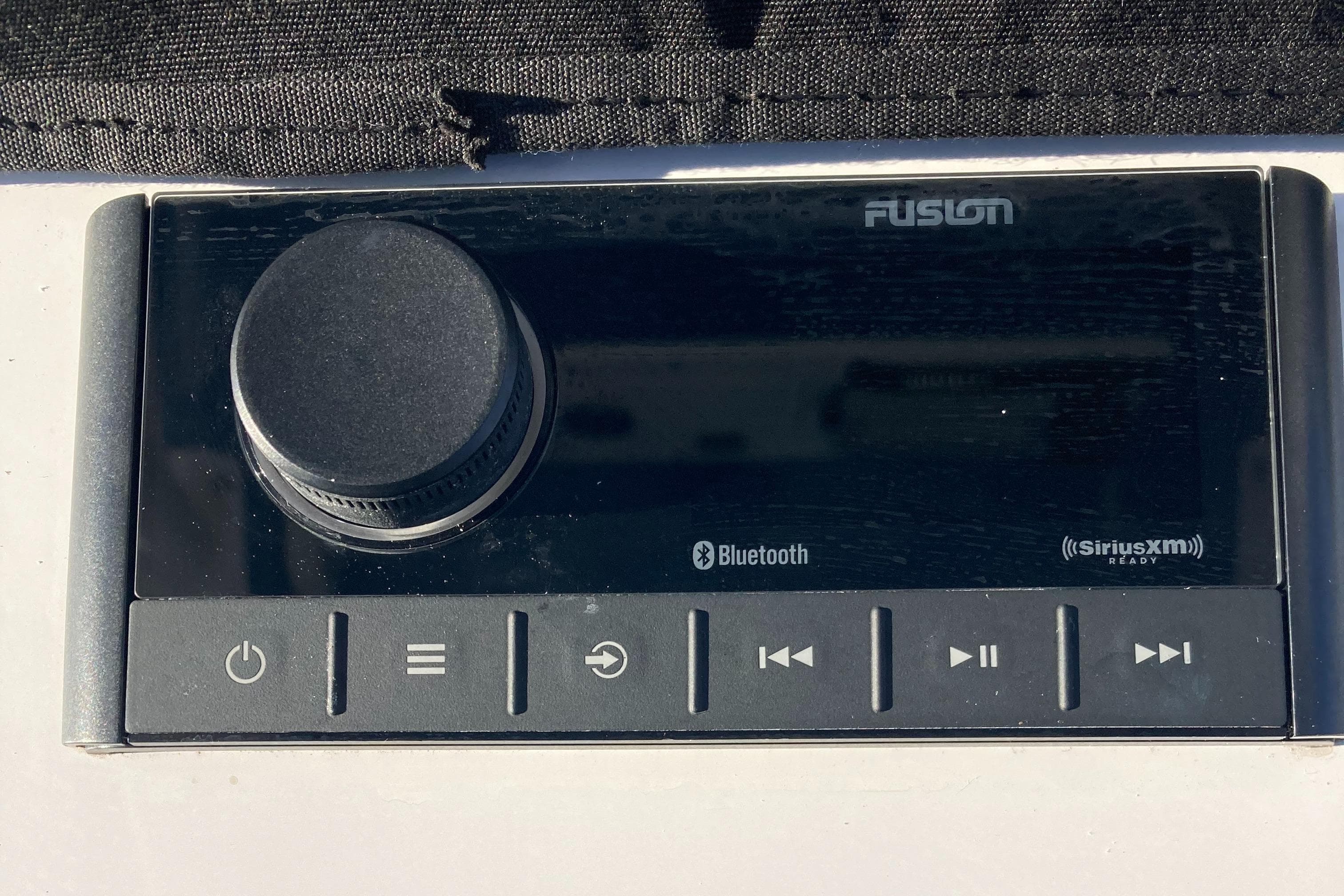 2023 Sportsman Open 242 Center Console audio system with Bluetooth and SiriusXM features.