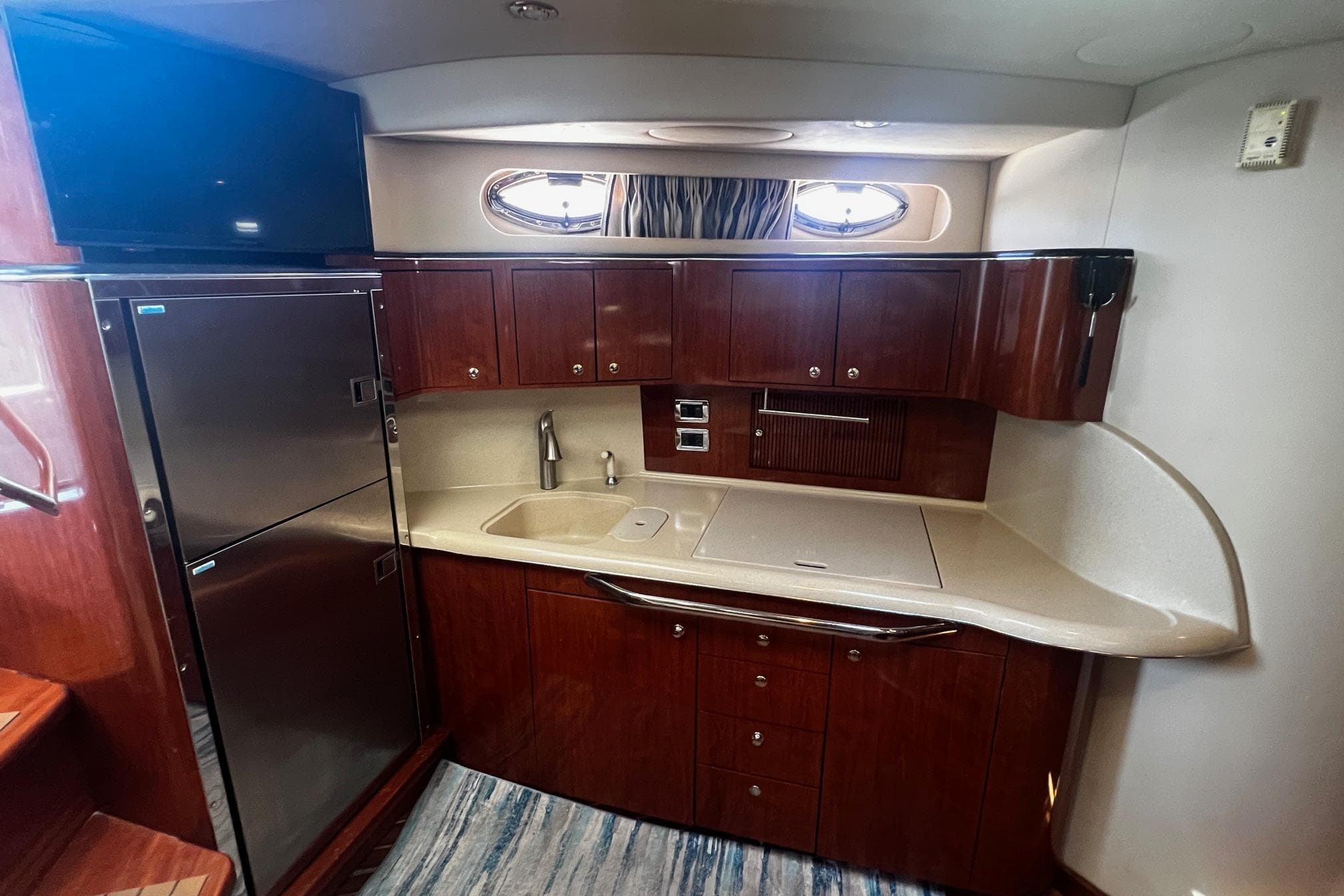 Luxurious kitchen area in a 2003 Sea Ray 410 Express Cruiser yacht.