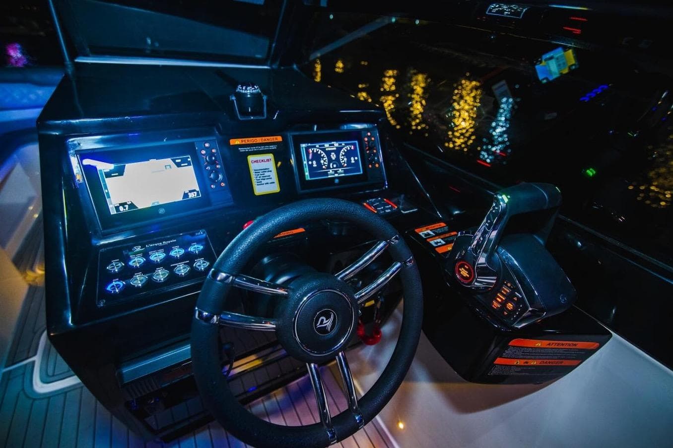 2024 L'acqua Royale LR280 GRAN CABRIO dashboard with illuminated controls and steering wheel at night.