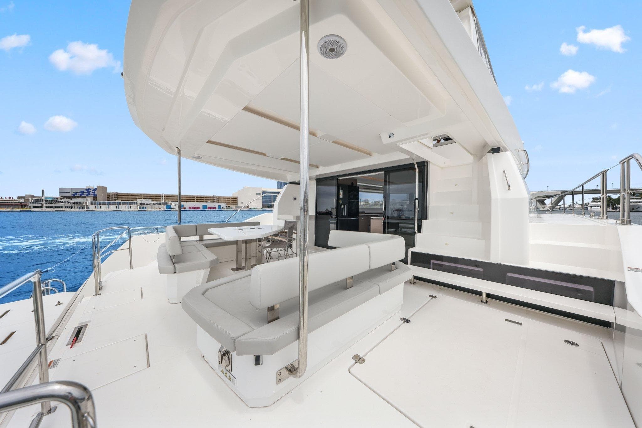 2025 Leopard 53 Powercat yacht deck with modern seating and ocean view.