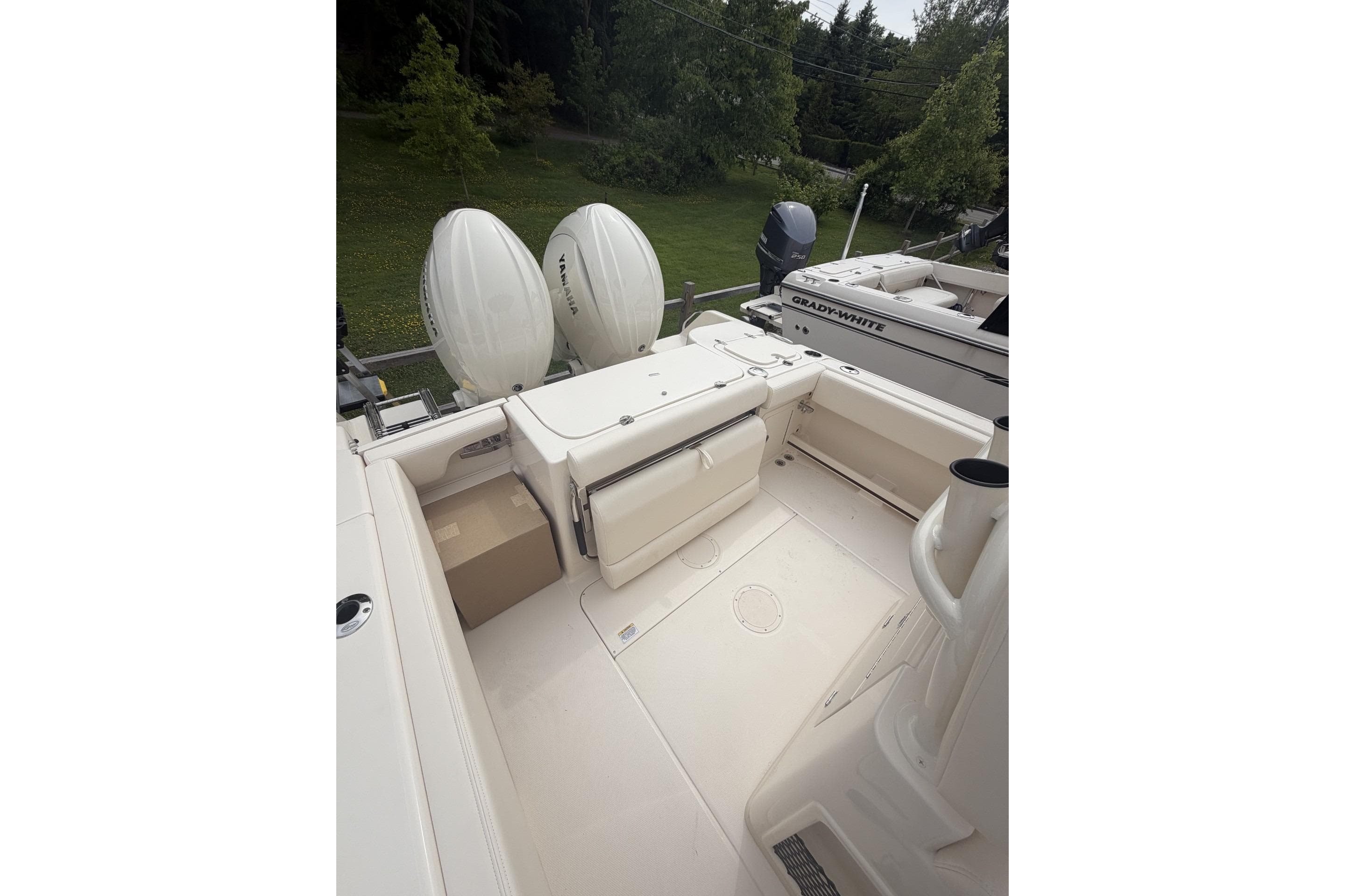 2026 Grady-White Fisherman 257 boat with dual outboard engines.