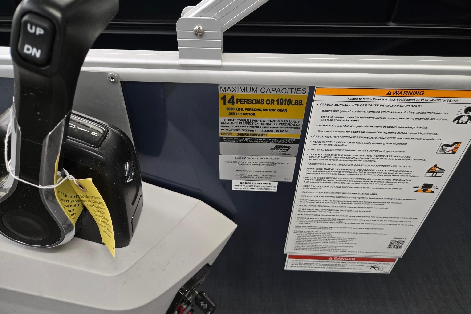 Control panel and capacity warning on 2026 Godfrey Sweetwater 2086 C boat.