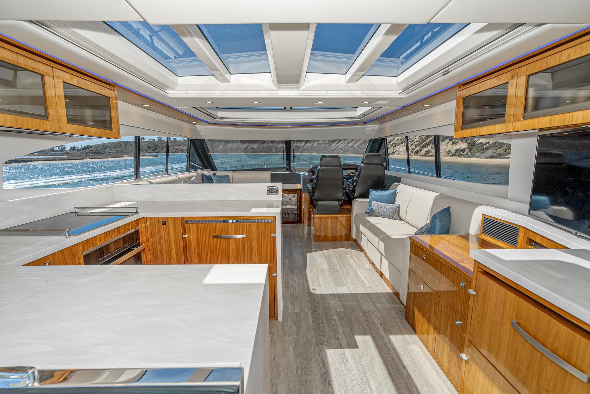 Luxurious interior of 2020 Riviera 6000 Sport Yacht with modern design and panoramic windows.