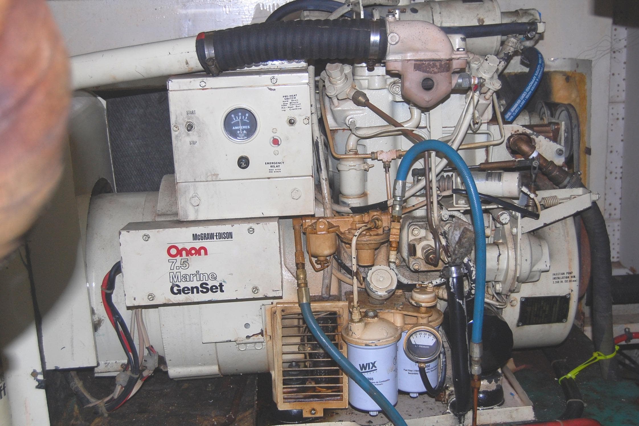 Onan 7.5 Marine GenSet engine in 1983 Island Gypsy 36 Quad Cabin.