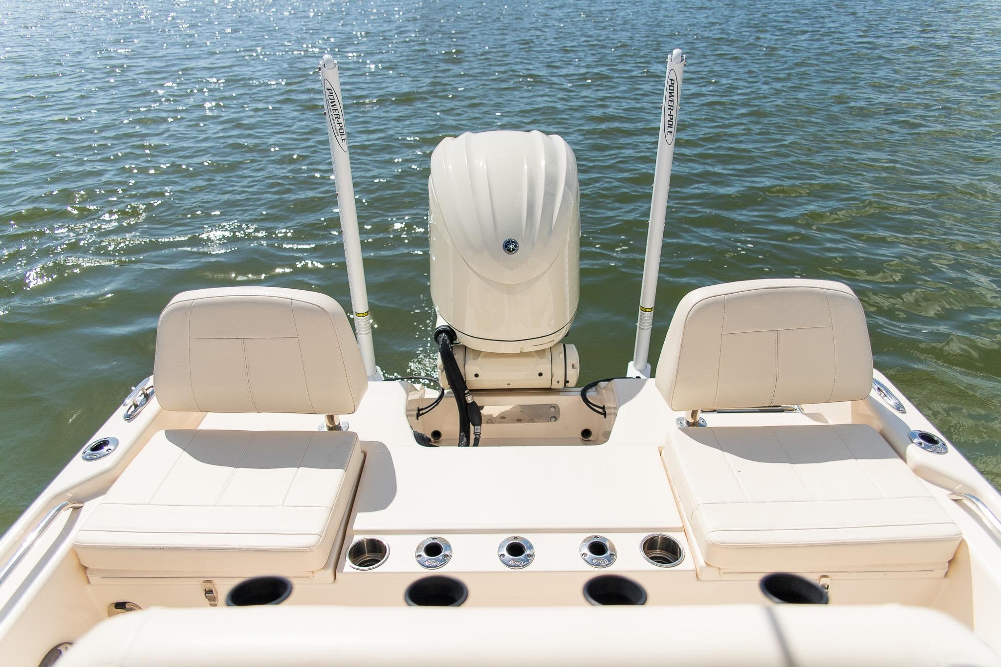 2024 Grady-White 231 Coastal Explorer boat with dual seats and outboard motor on water.