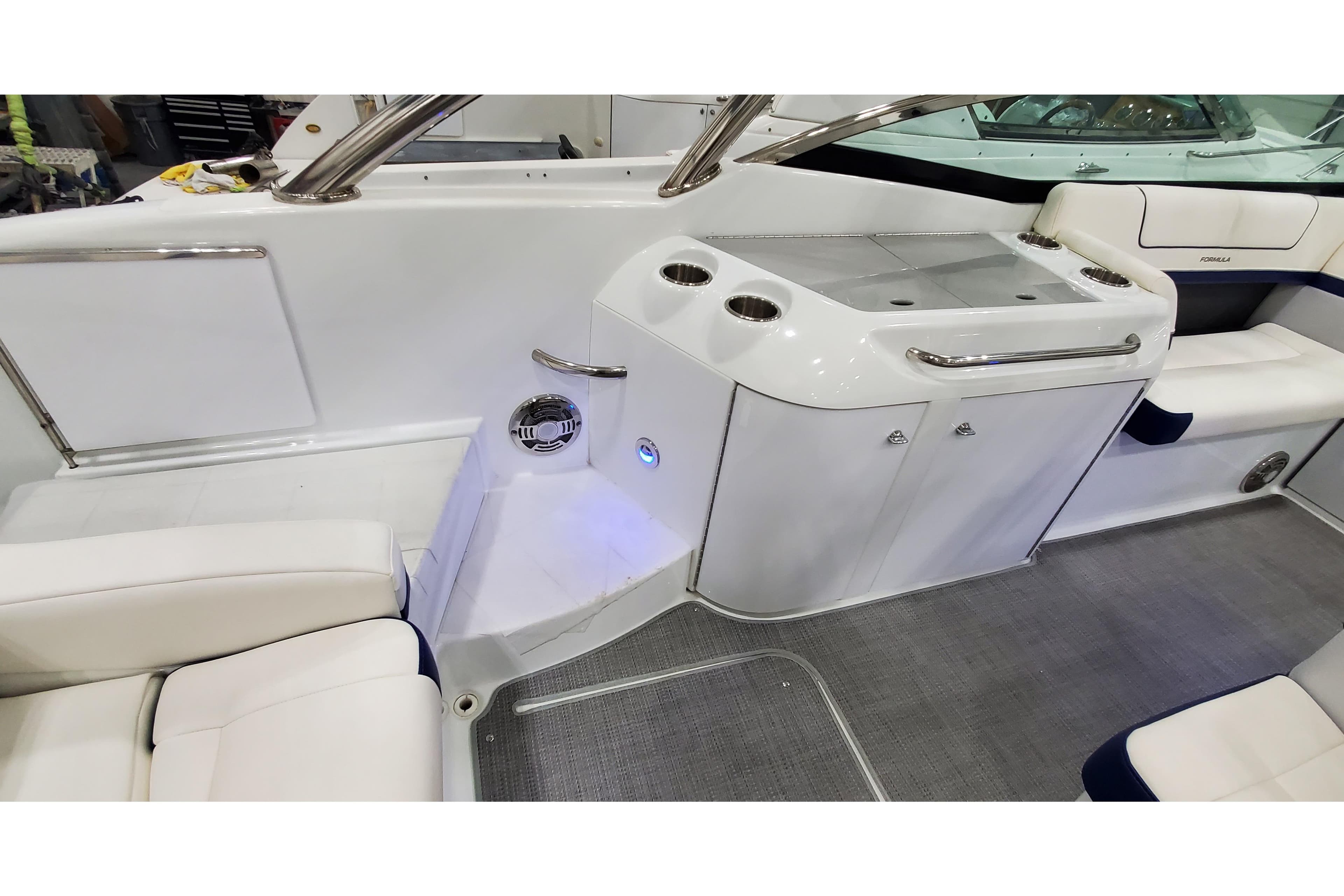 2013 Formula 310 Bowrider interior with seating and built-in cup holders.
