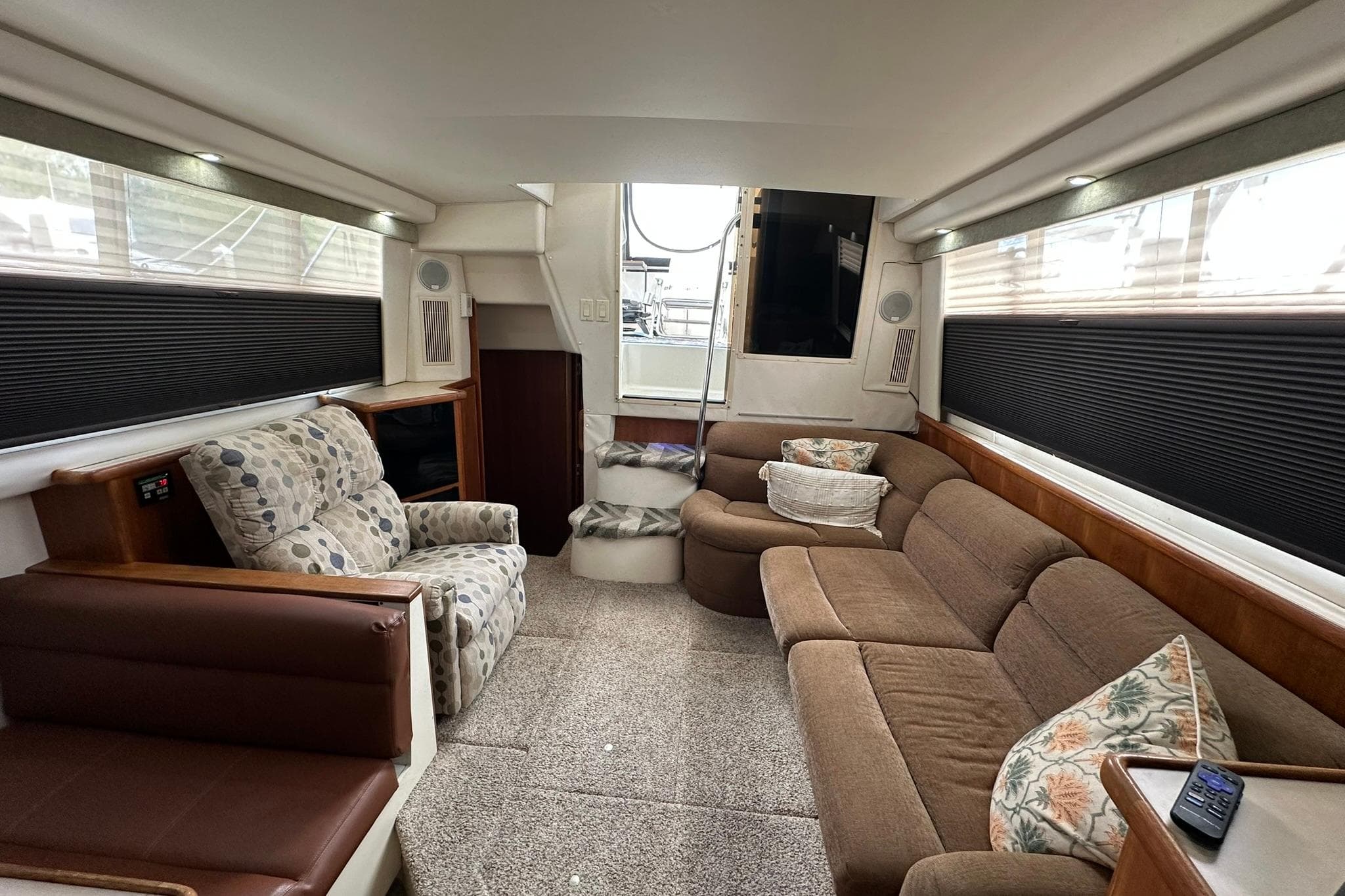 Interior of 1997 Carver 355 Aft Cabin Motor Yacht with cozy seating and modern decor.