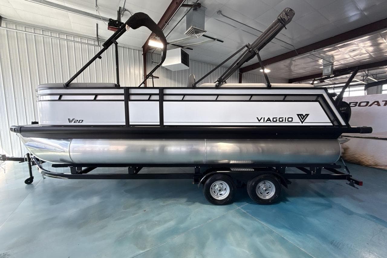 2026 Viaggio V20S pontoon boat in showroom, side view, on trailer.