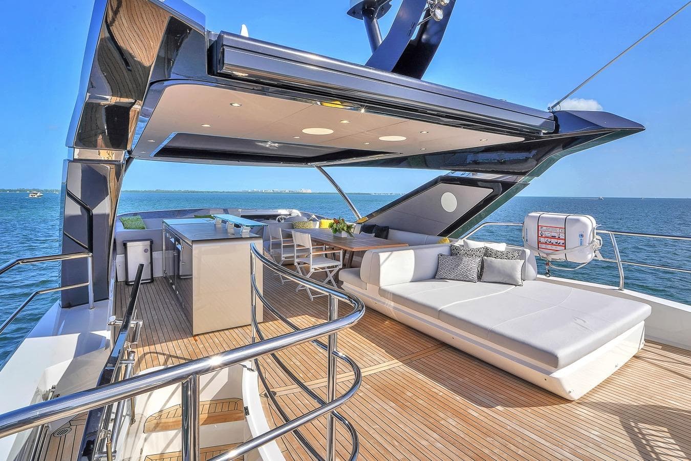 Luxurious 2024 Sunseeker 88 Yacht deck with modern seating and ocean view.