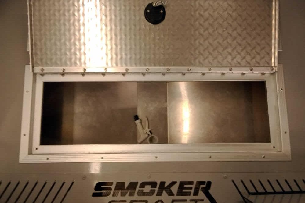 2026 Smoker Craft Phantom 20 X2 Offshore boat storage compartment with open hatch.