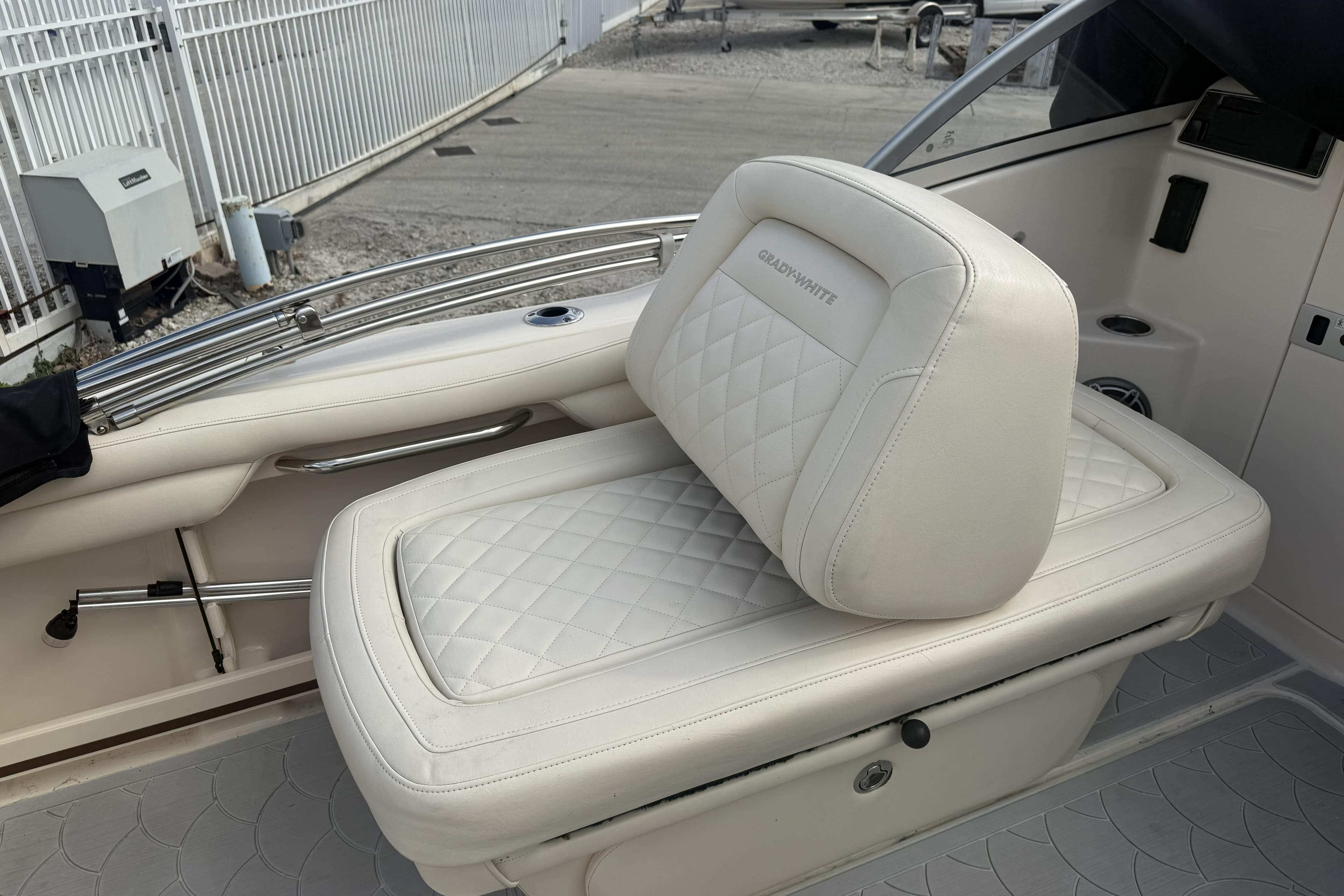 2023 Grady-White Freedom 215 boat seat with quilted white upholstery.