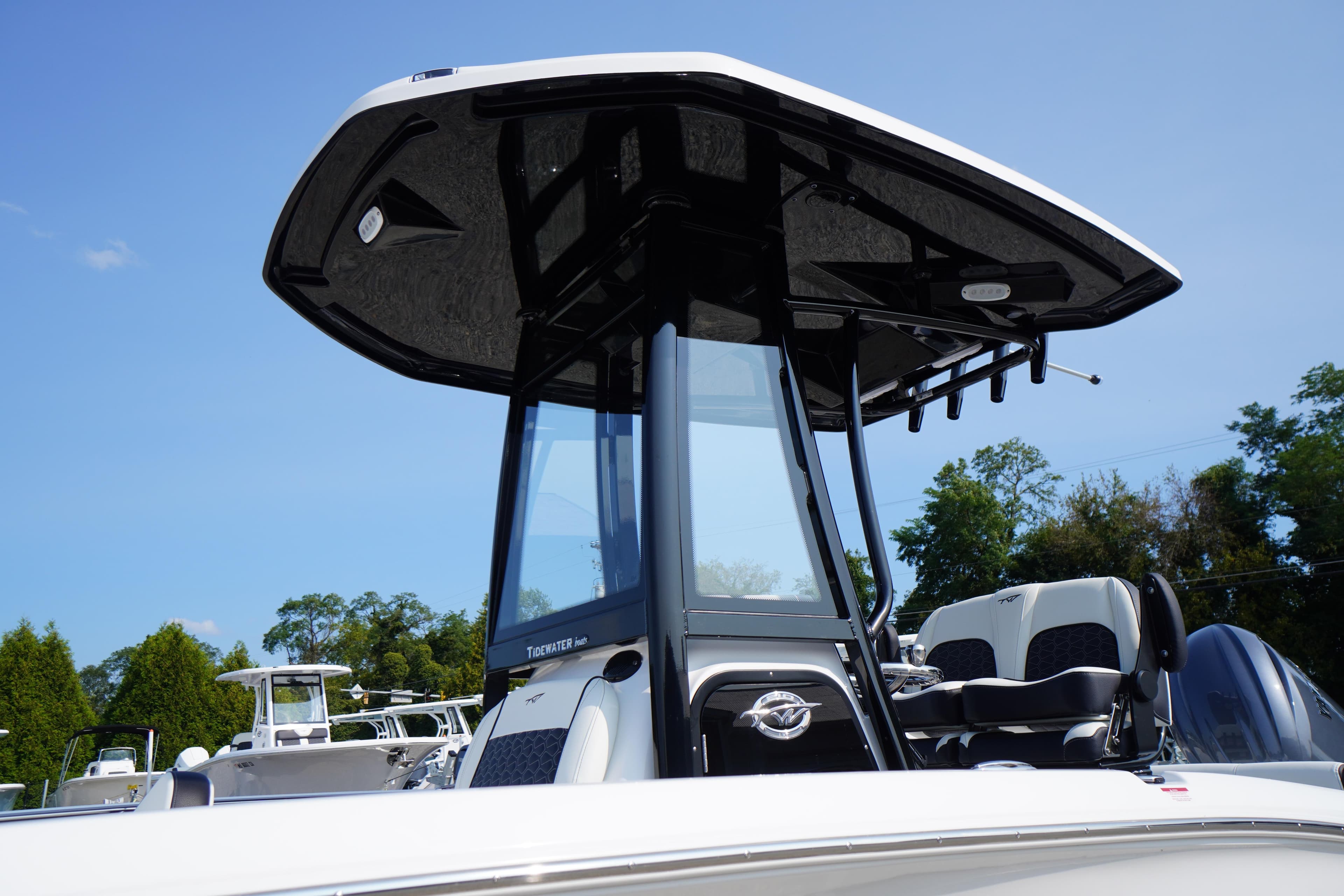 2026 Tidewater 210 LXF boat with sleek design and modern features, under clear blue sky.
