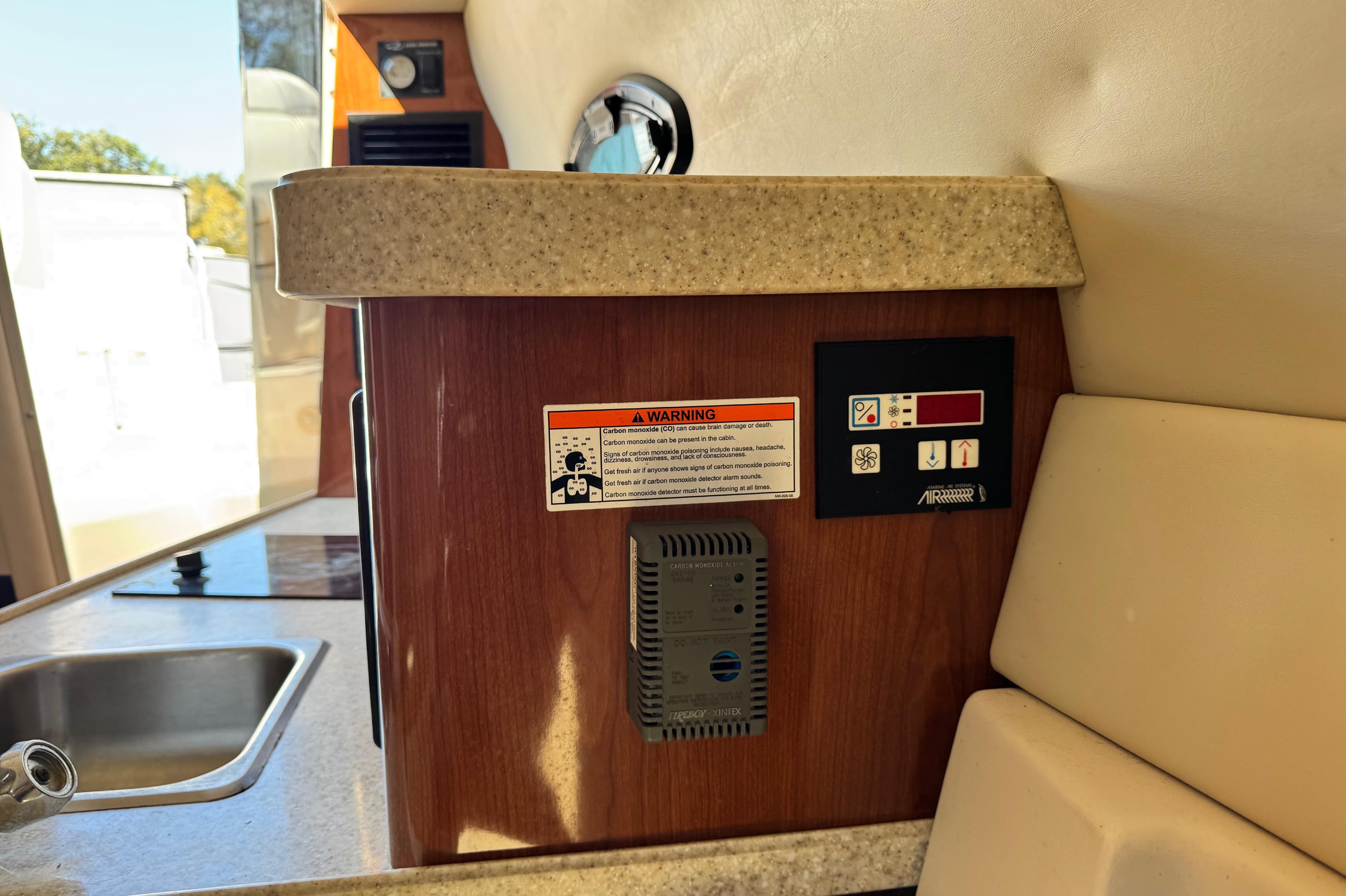 2007 Regal Commodore 2665 interior with control panel and warning label.