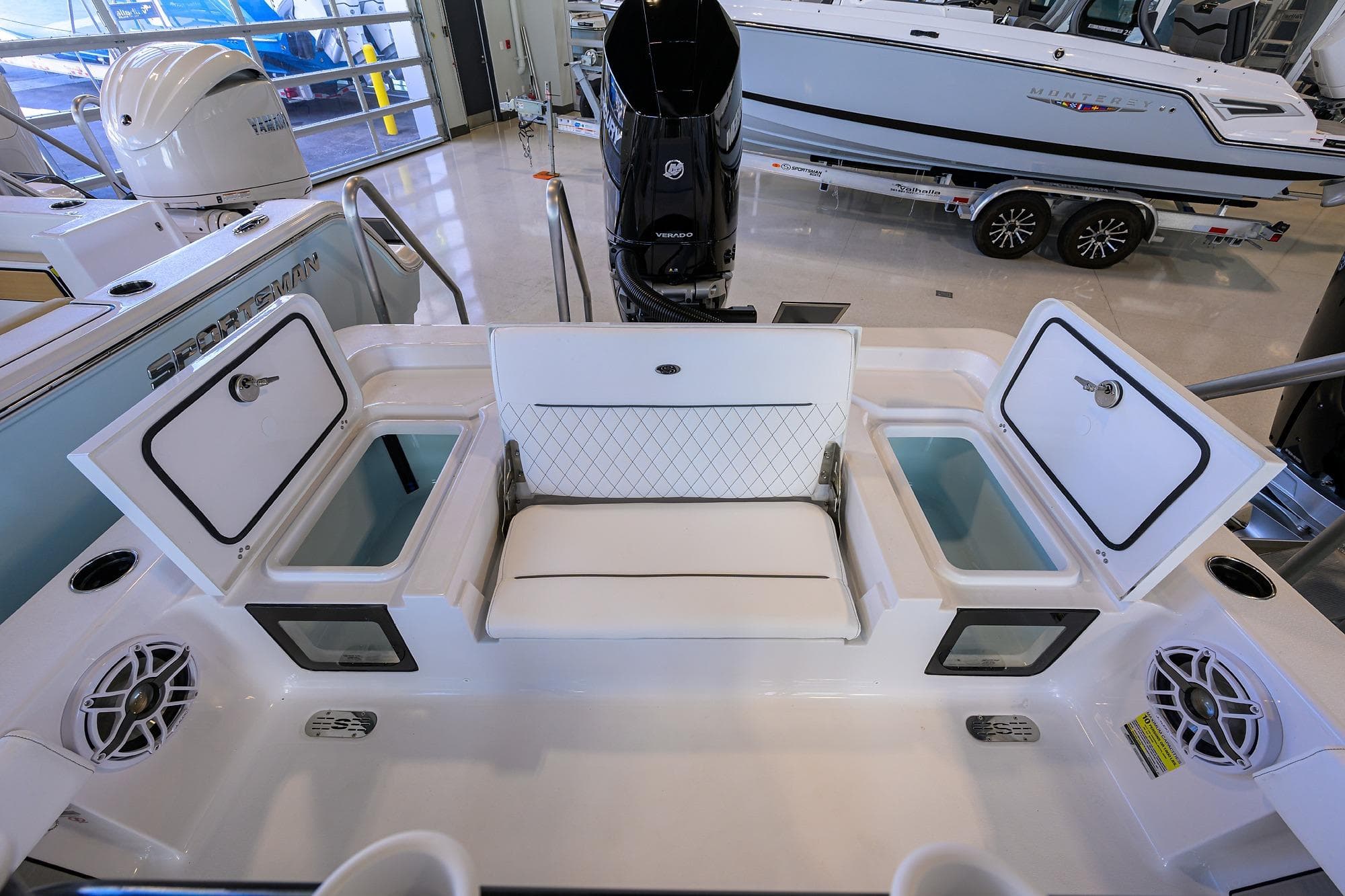 2026 Sportsman Masters 247OE Bay Boat interior with storage compartments and seating.