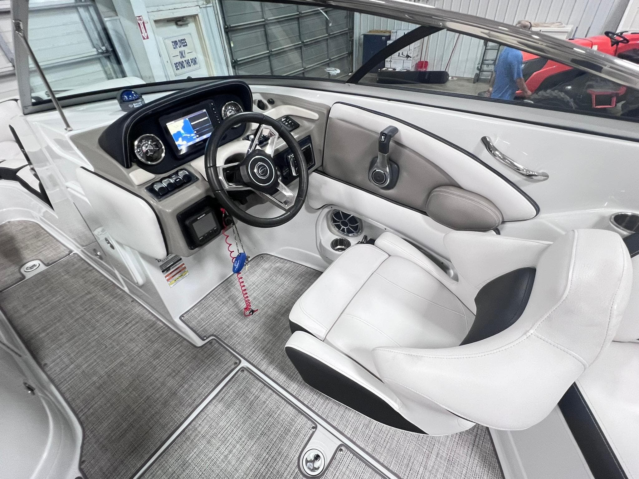 Interior of 2020 Crownline Eclipse E225 XS boat with modern dashboard and steering wheel.