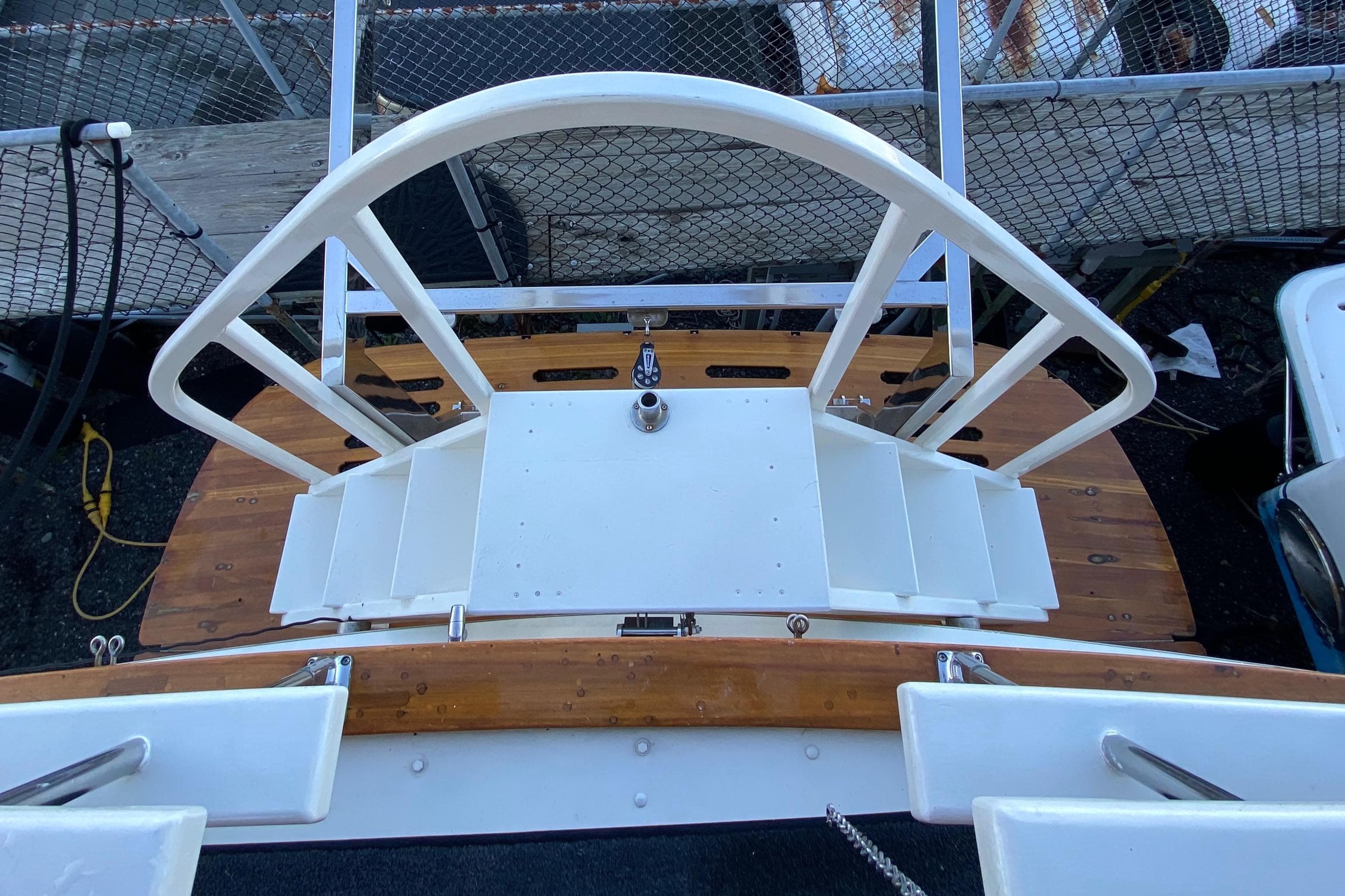 1971 Matthews Custom Pilothouse Motor Yacht deck with white railing and wooden flooring.