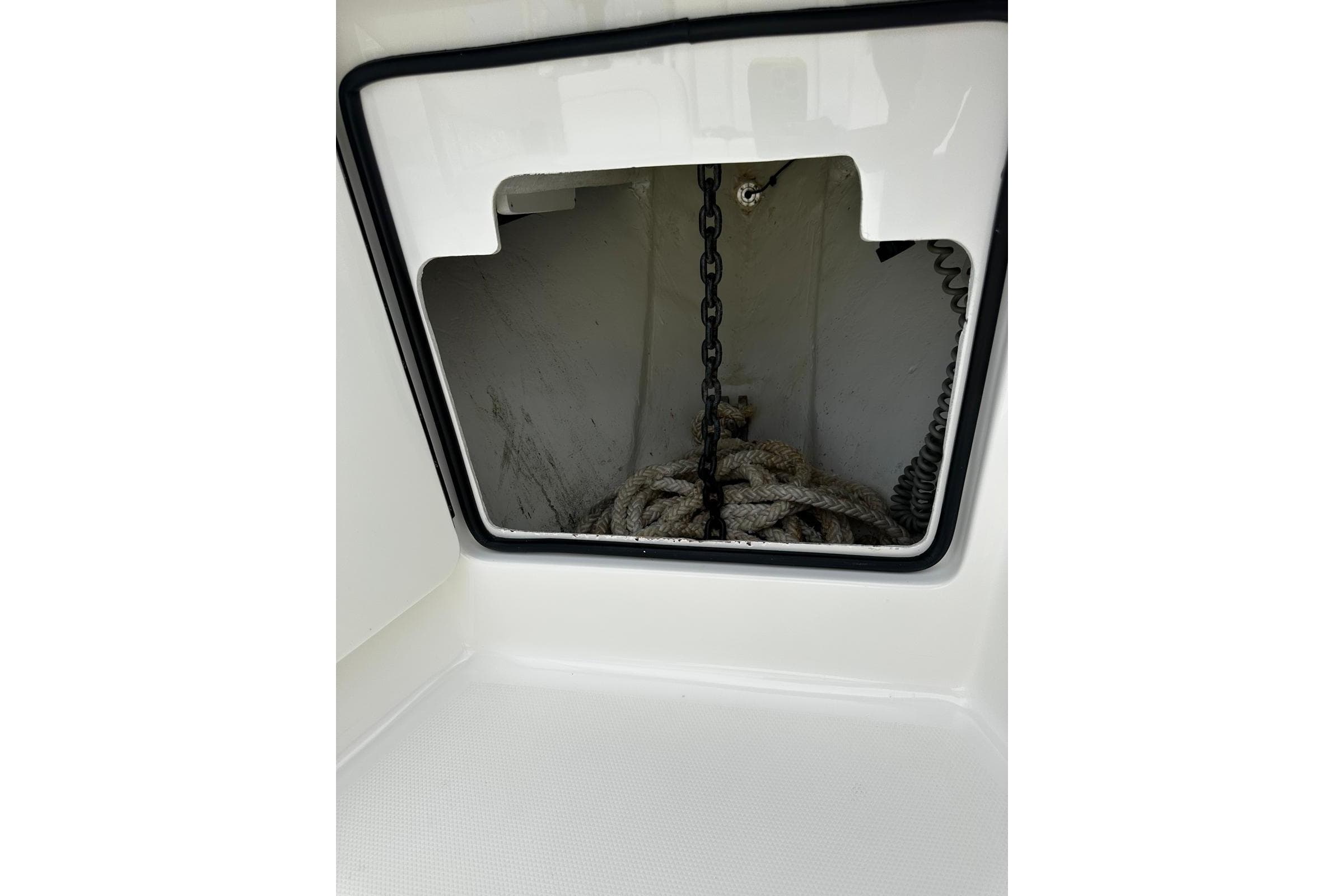 Anchor storage compartment on a 2022 SeaVee 390Z boat, featuring chain and rope.