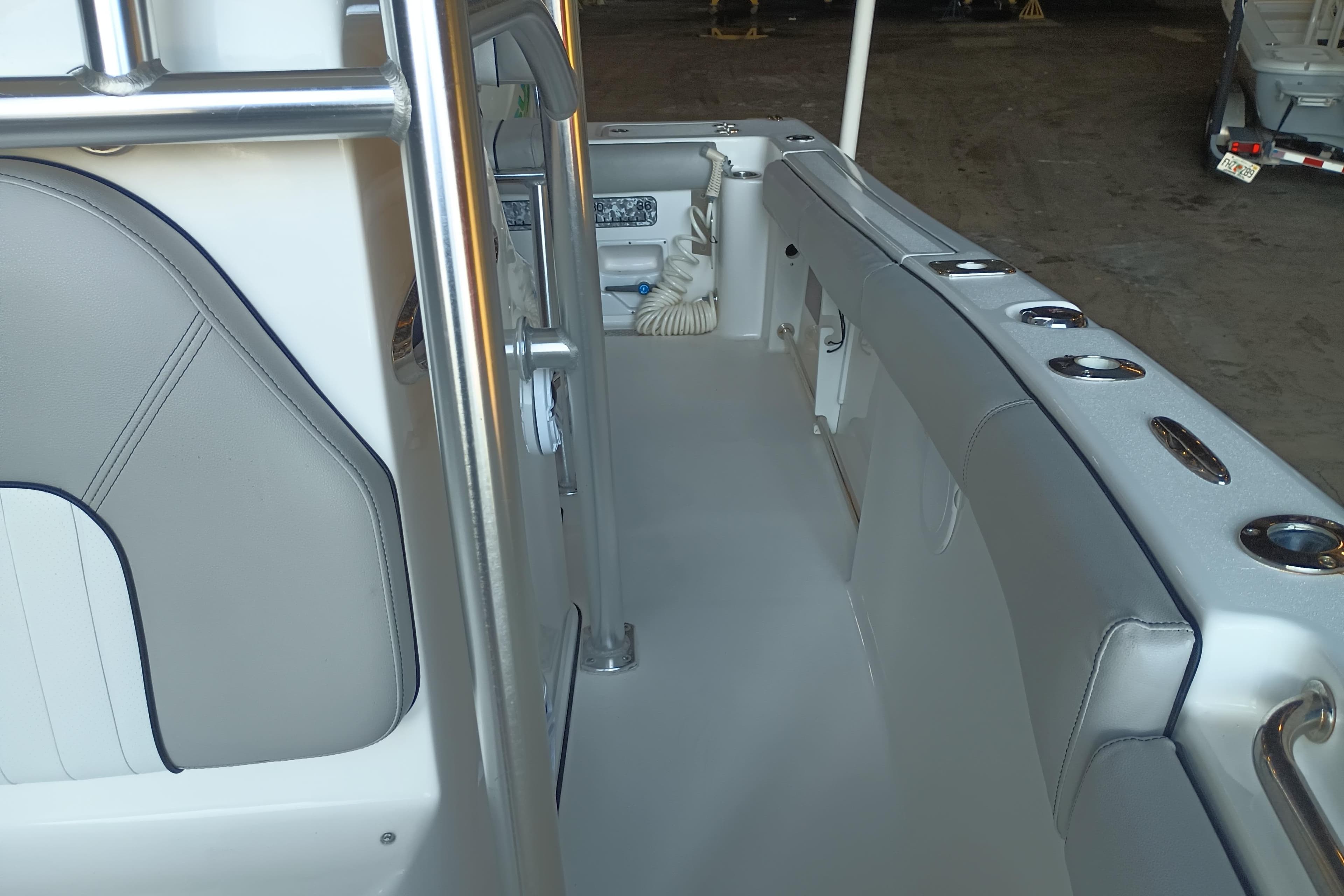 2017 Seapro 219 boat interior with sleek seating and stainless steel fixtures.