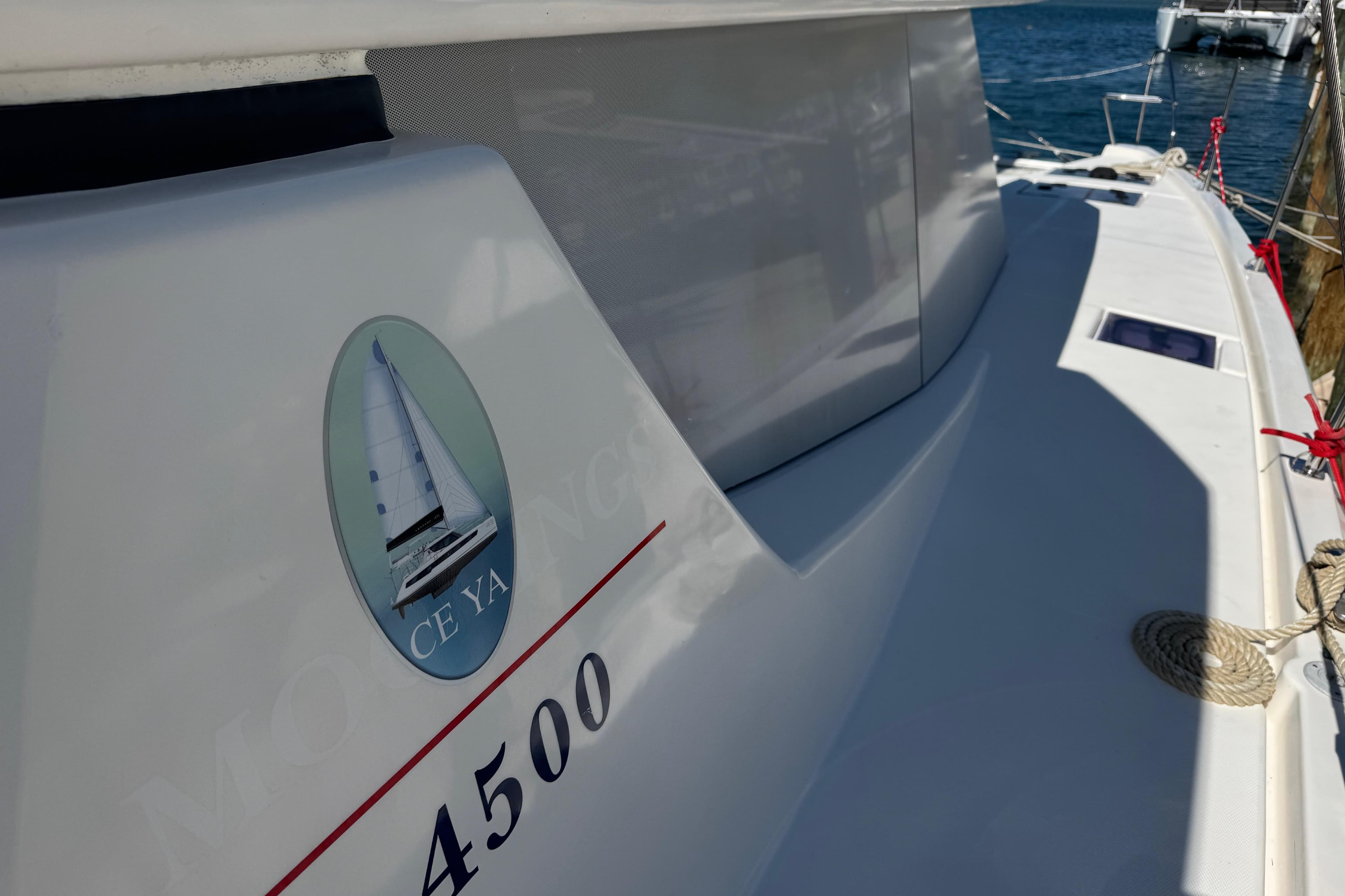 2021 Leopard 45 catamaran docked, featuring sleek design and nautical emblem.