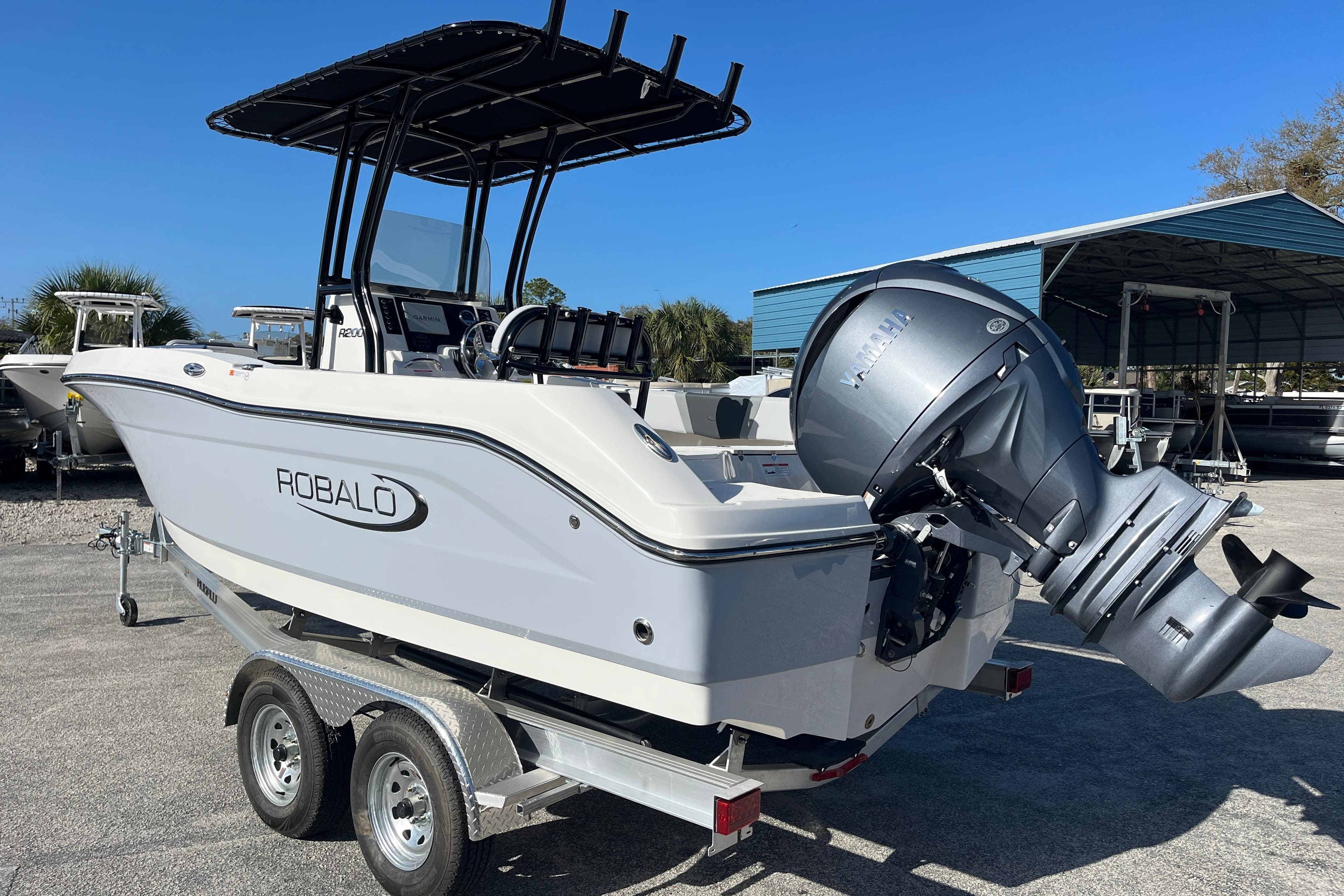 2026 Robalo R200 Center Console boat on trailer, featuring Yamaha outboard motor.