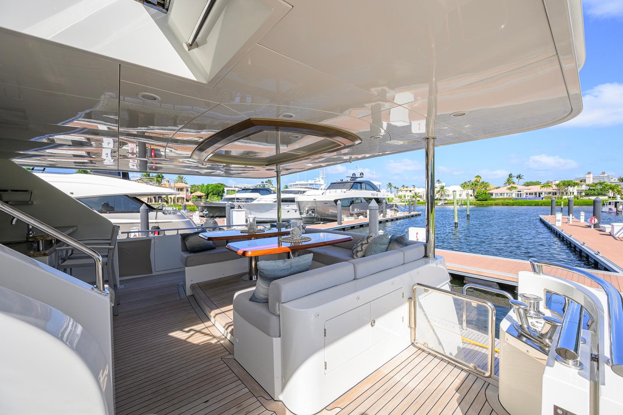 Luxurious 2017 Ocean Alexander 100 Motoryacht deck with elegant seating and waterfront view.