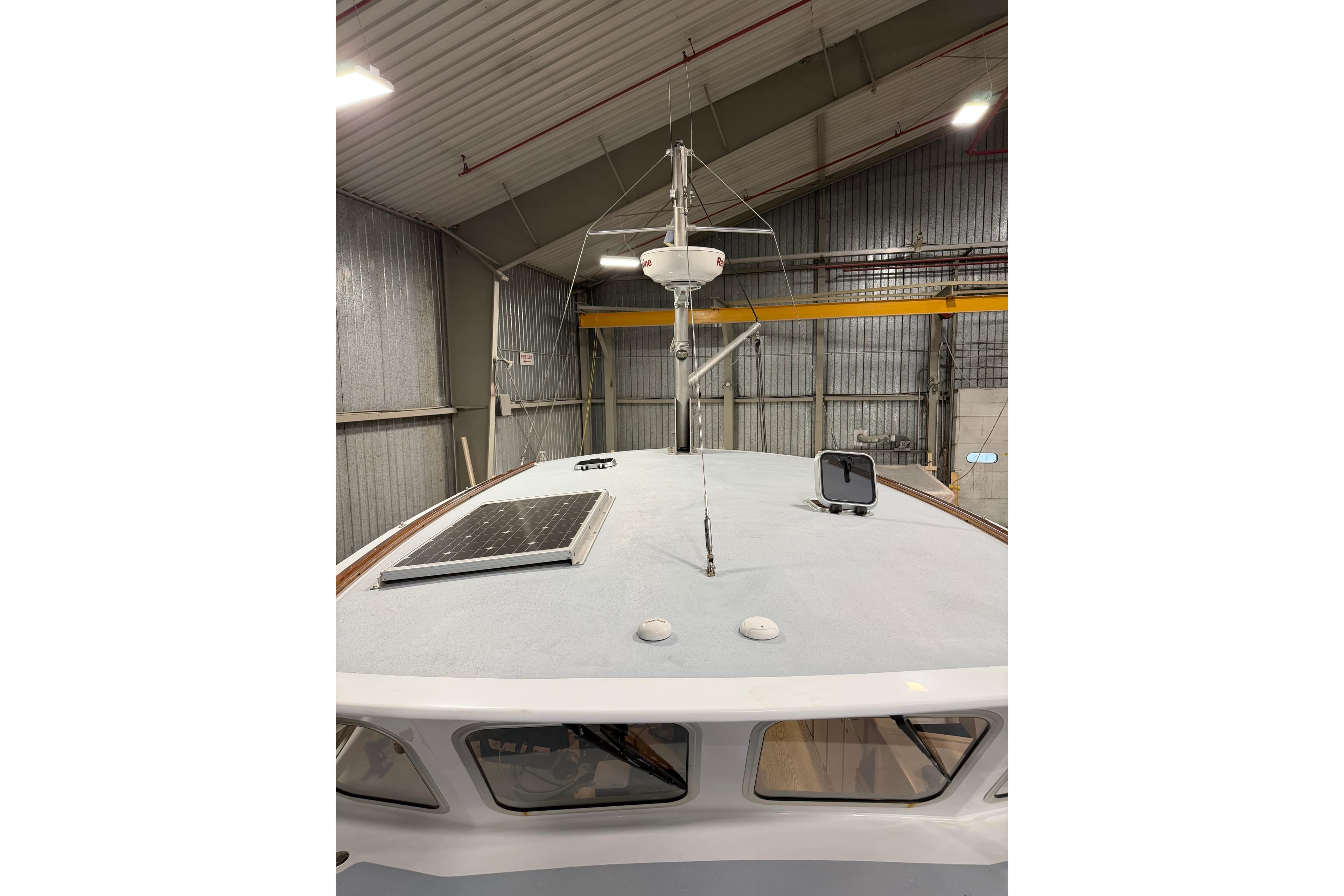 2022 Covey Island 38 Lobster Yacht in a warehouse, featuring a solar panel on deck.