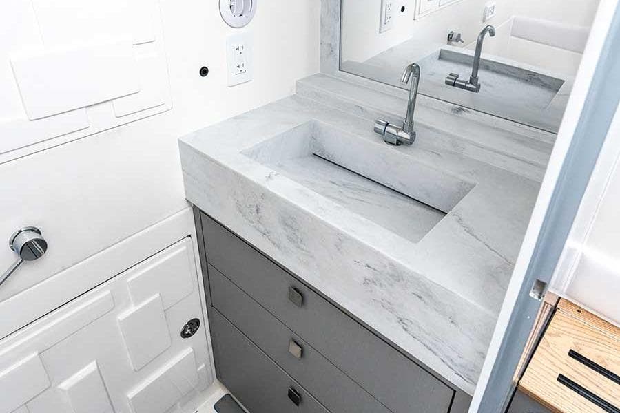 Modern bathroom sink with marble countertop in AMP 433, 2026 model.