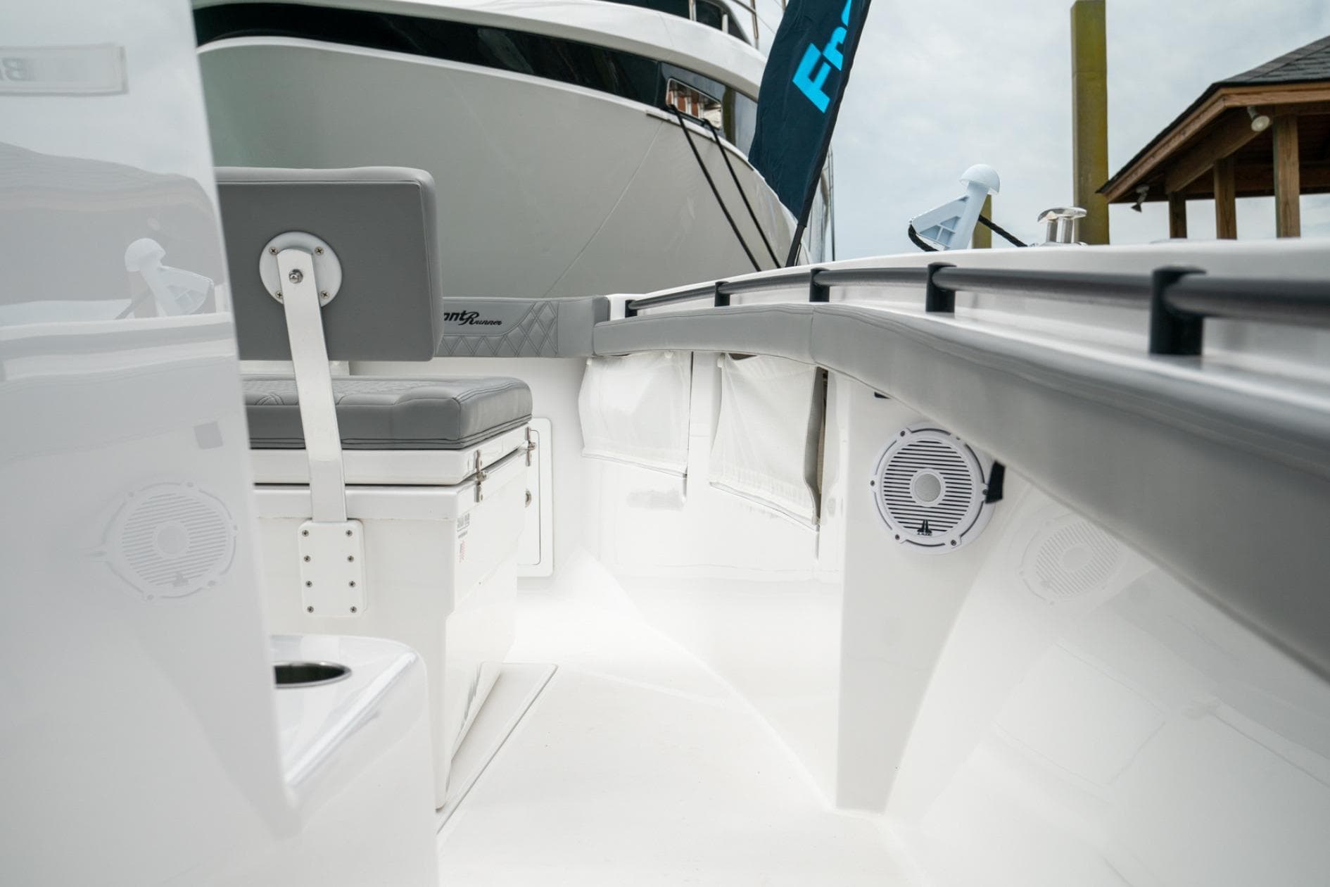 2026 Front Runner 33' Center Console boat interior with seating and speakers.