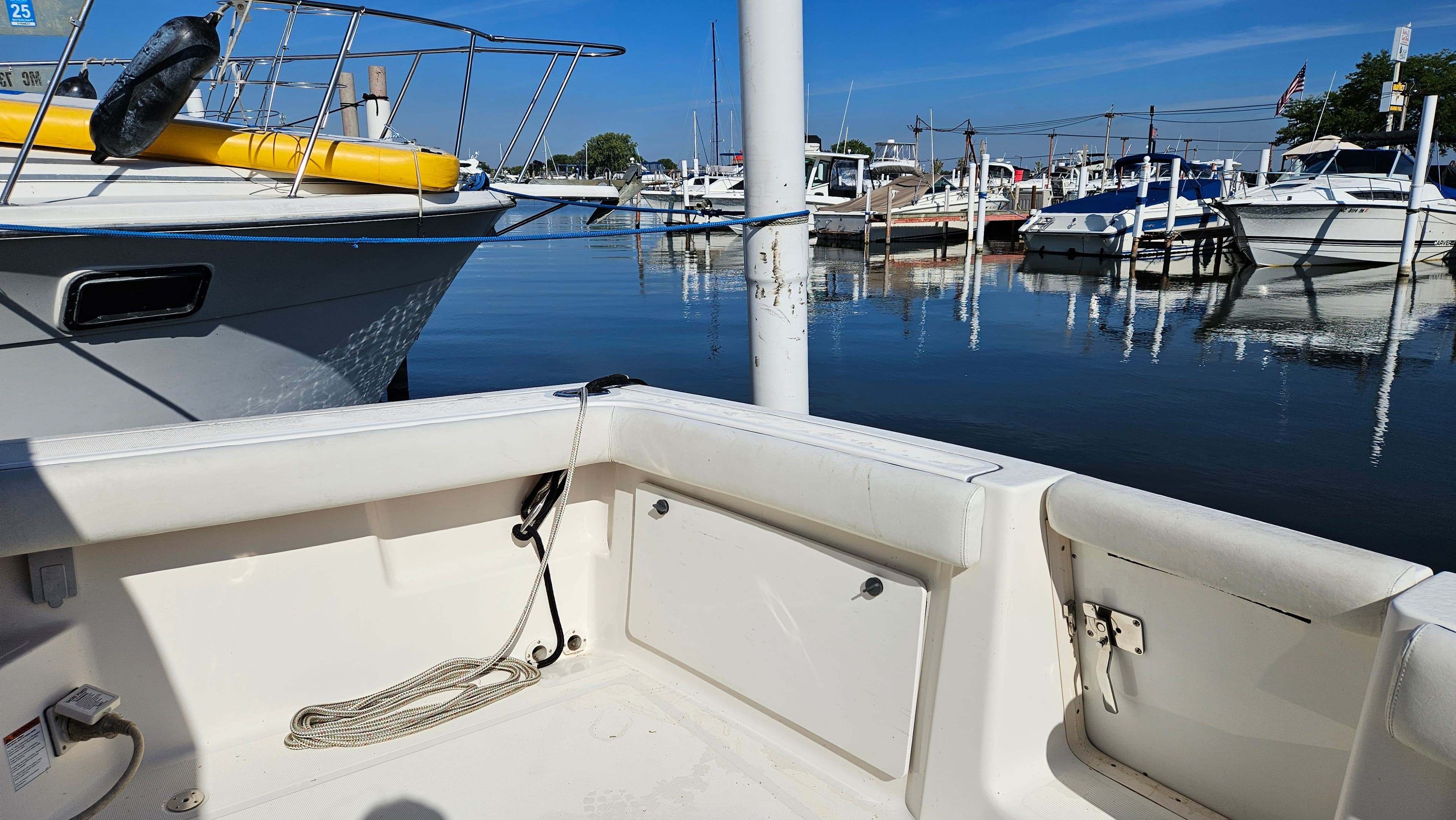 Tiara Yachts 2900 Coronet 2006 in harbor, sunny day.