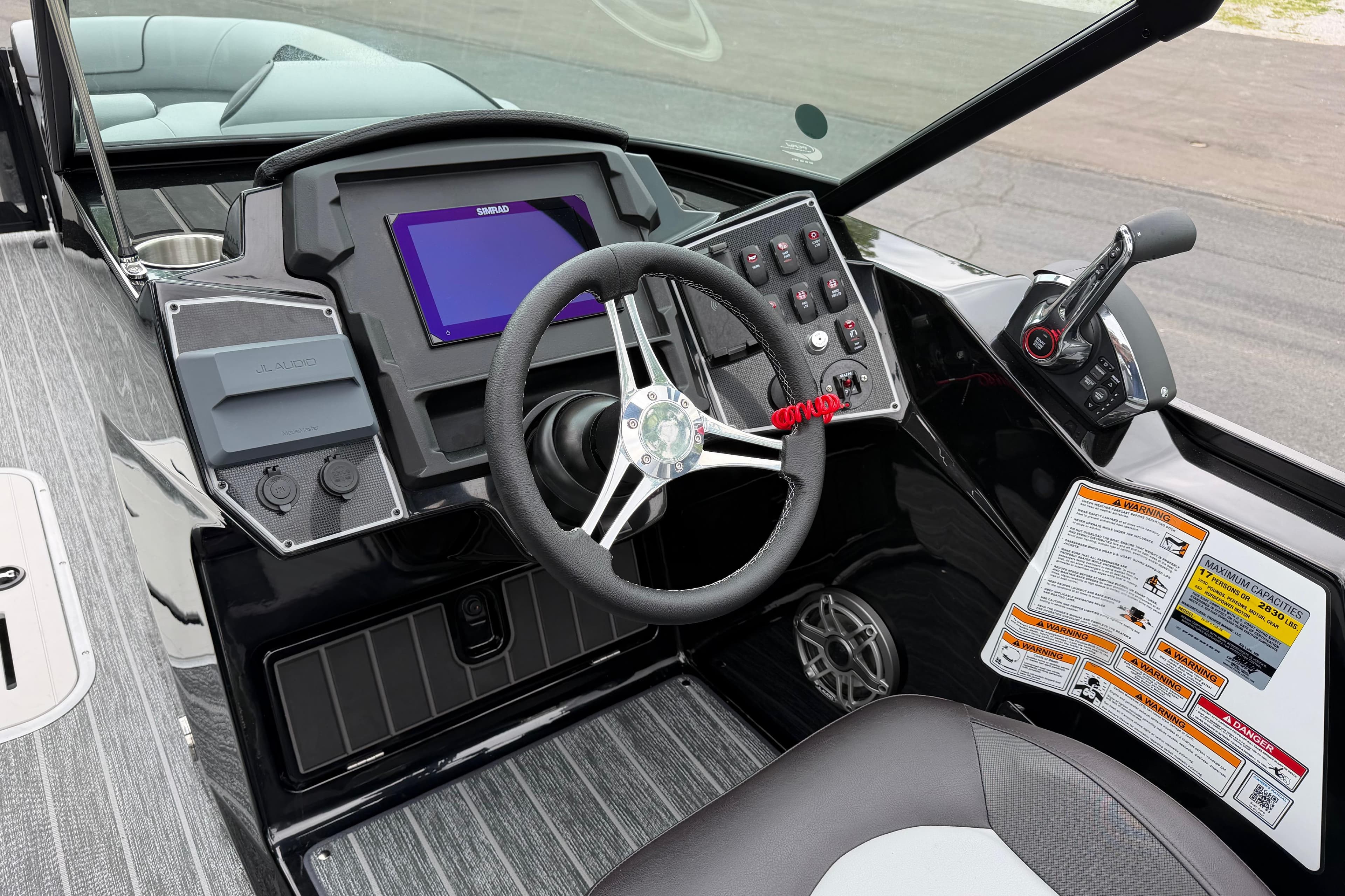 Helm of 2026 Premier 250 Solaris Sport boat with modern controls and sleek design.