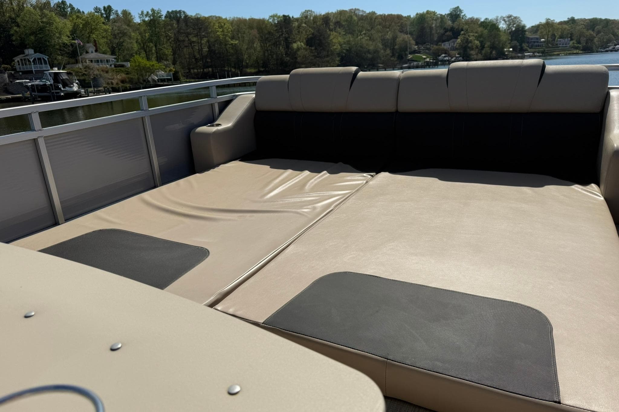 2018 Avalon Catalina Funship Platinum boat interior with spacious seating and scenic lake view.