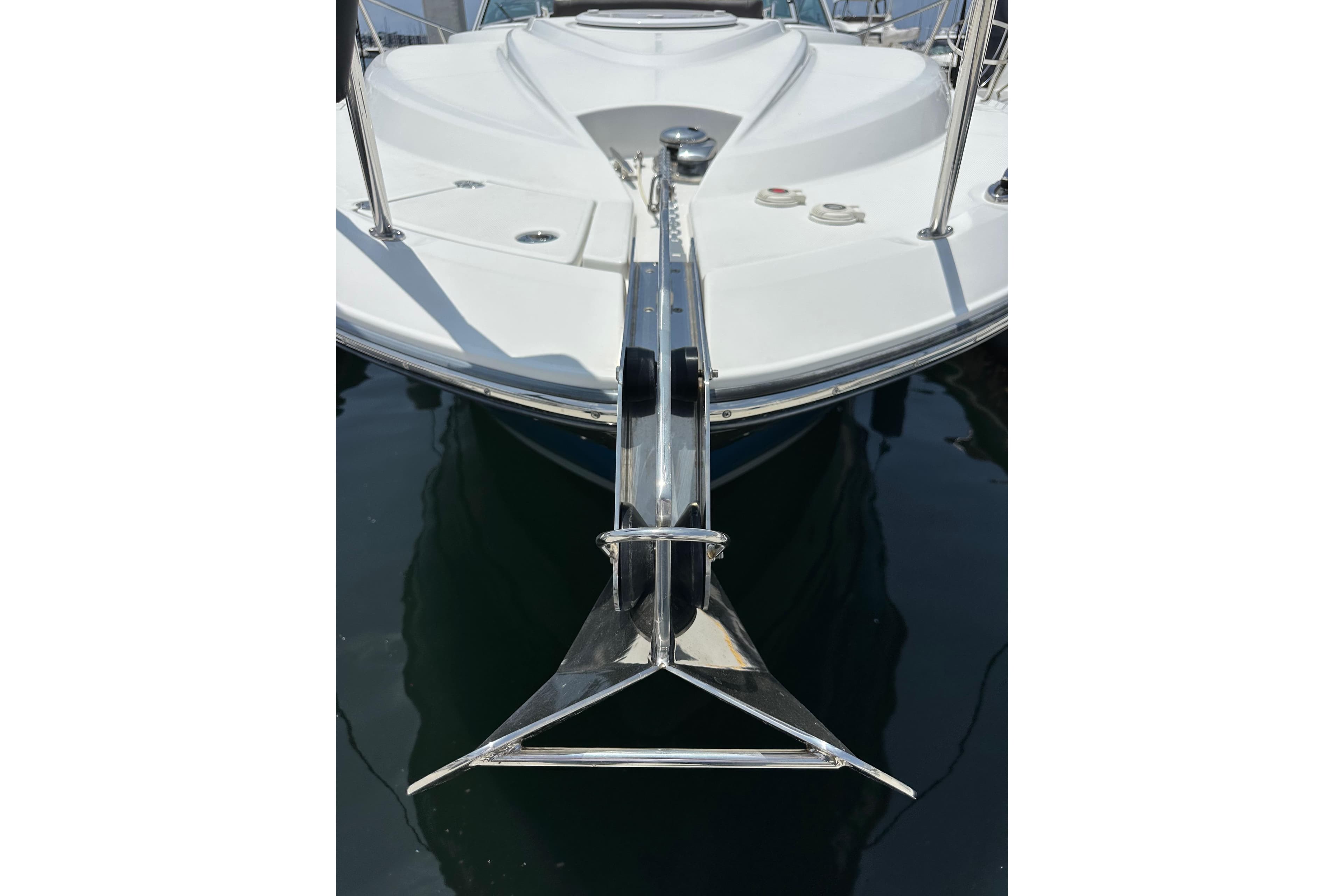 2020 Monterey 355 Sport Yacht bow with stainless steel anchor in marina.