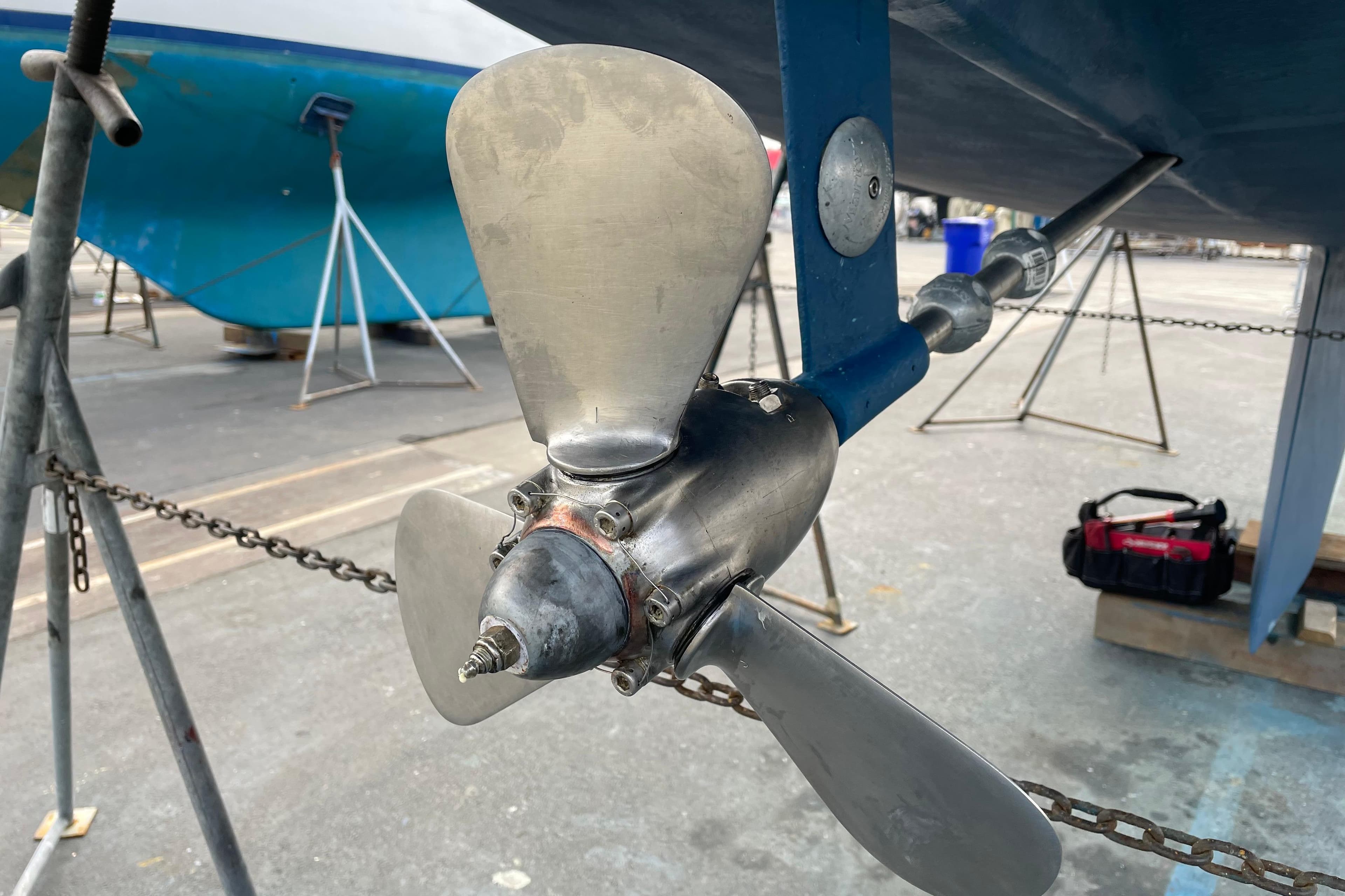 Propeller of a 2004 Catalina 36 MkII sailboat on a stand in a boatyard.