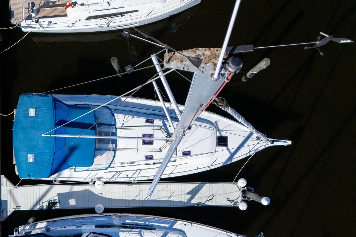 Aerial view of 2022 Beneteau Oceanis 40.1 sailboat docked at marina.