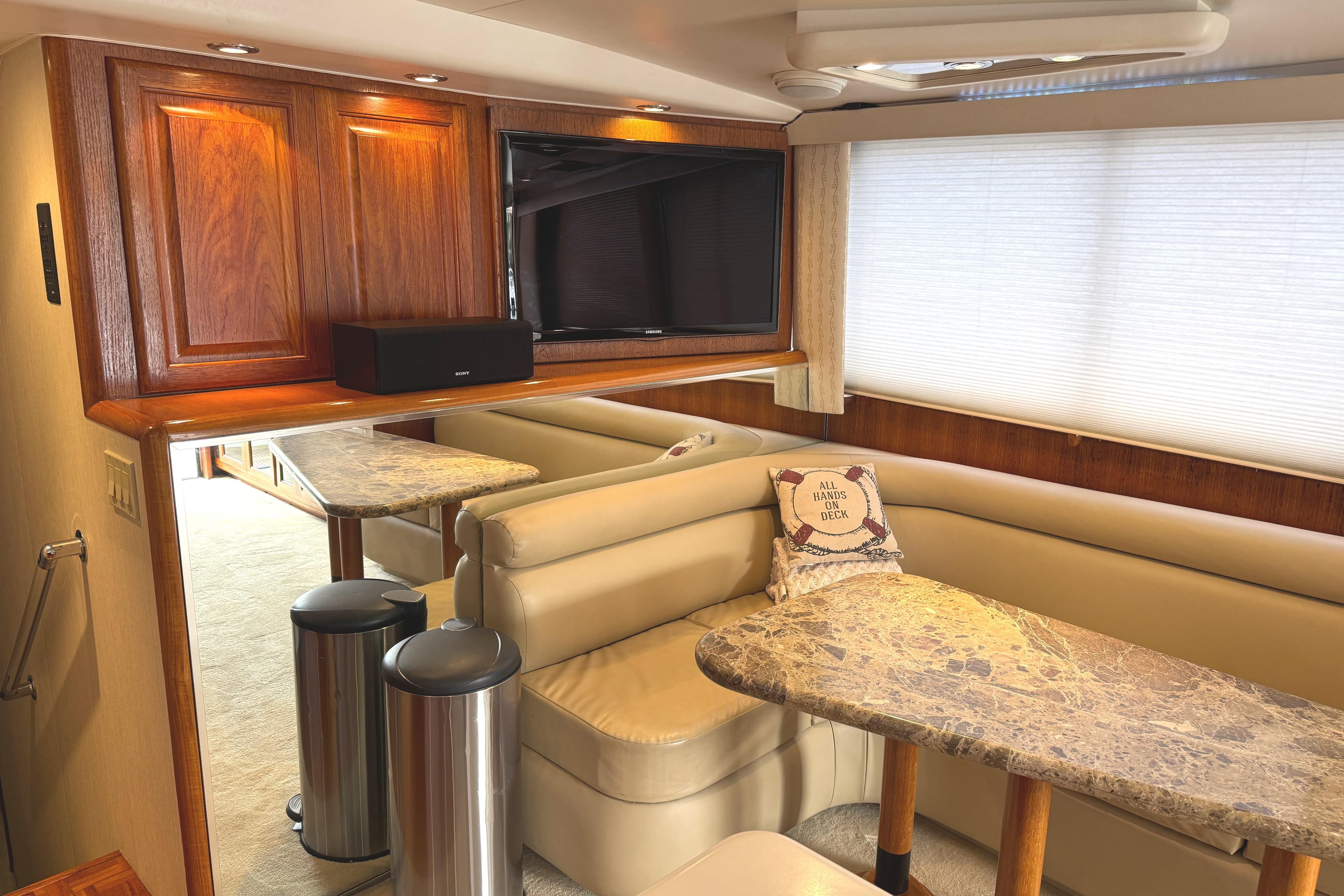 Interior of 1991 Viking 53 Convertible yacht with cozy seating and elegant decor.