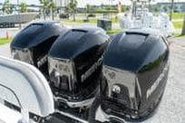 Triple outboard motors on a 2007 Fountain 38 CC Tournament Edition boat.