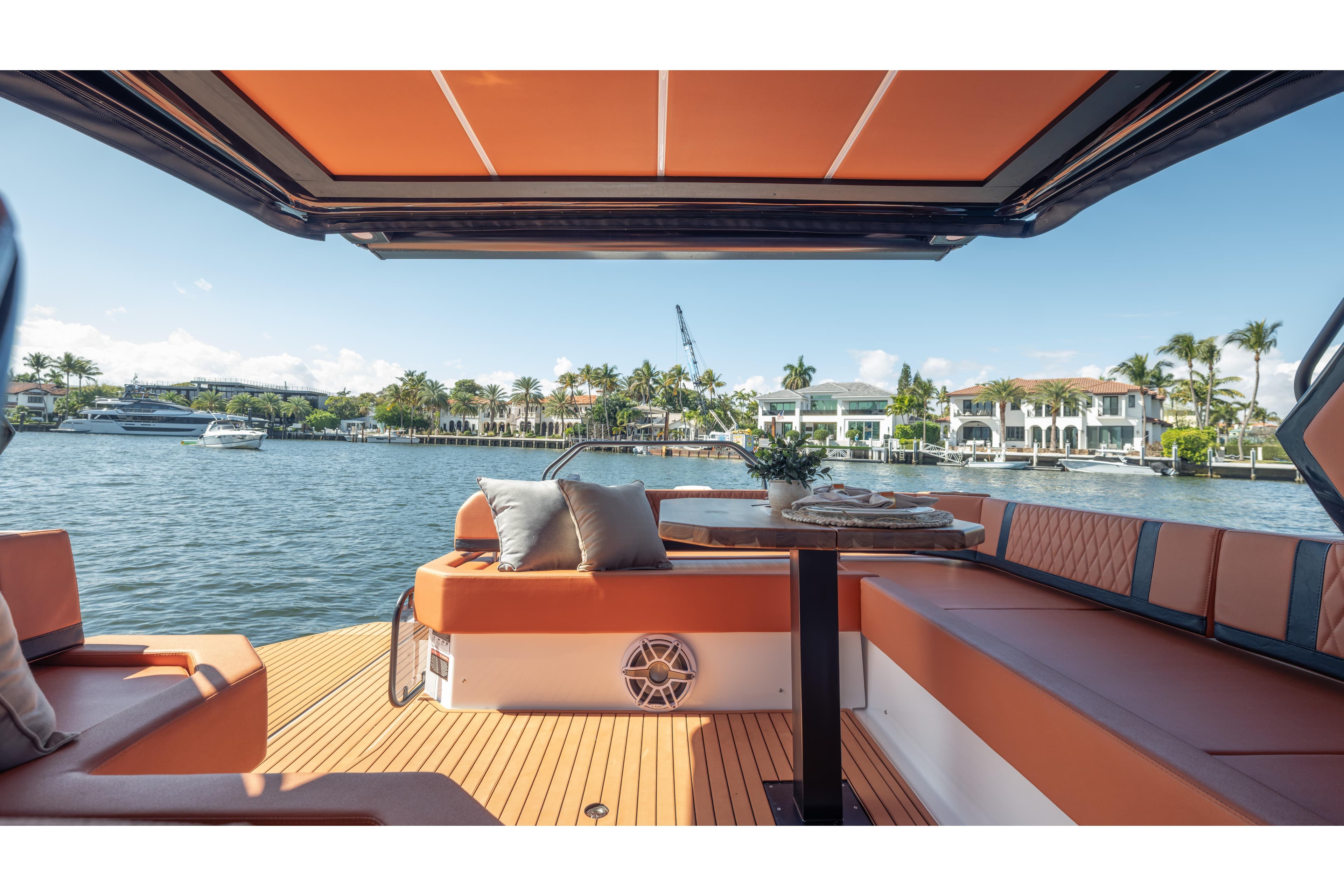 Luxurious Hanover 387 yacht interior with waterfront view, featuring elegant seating and table, 2026 model.