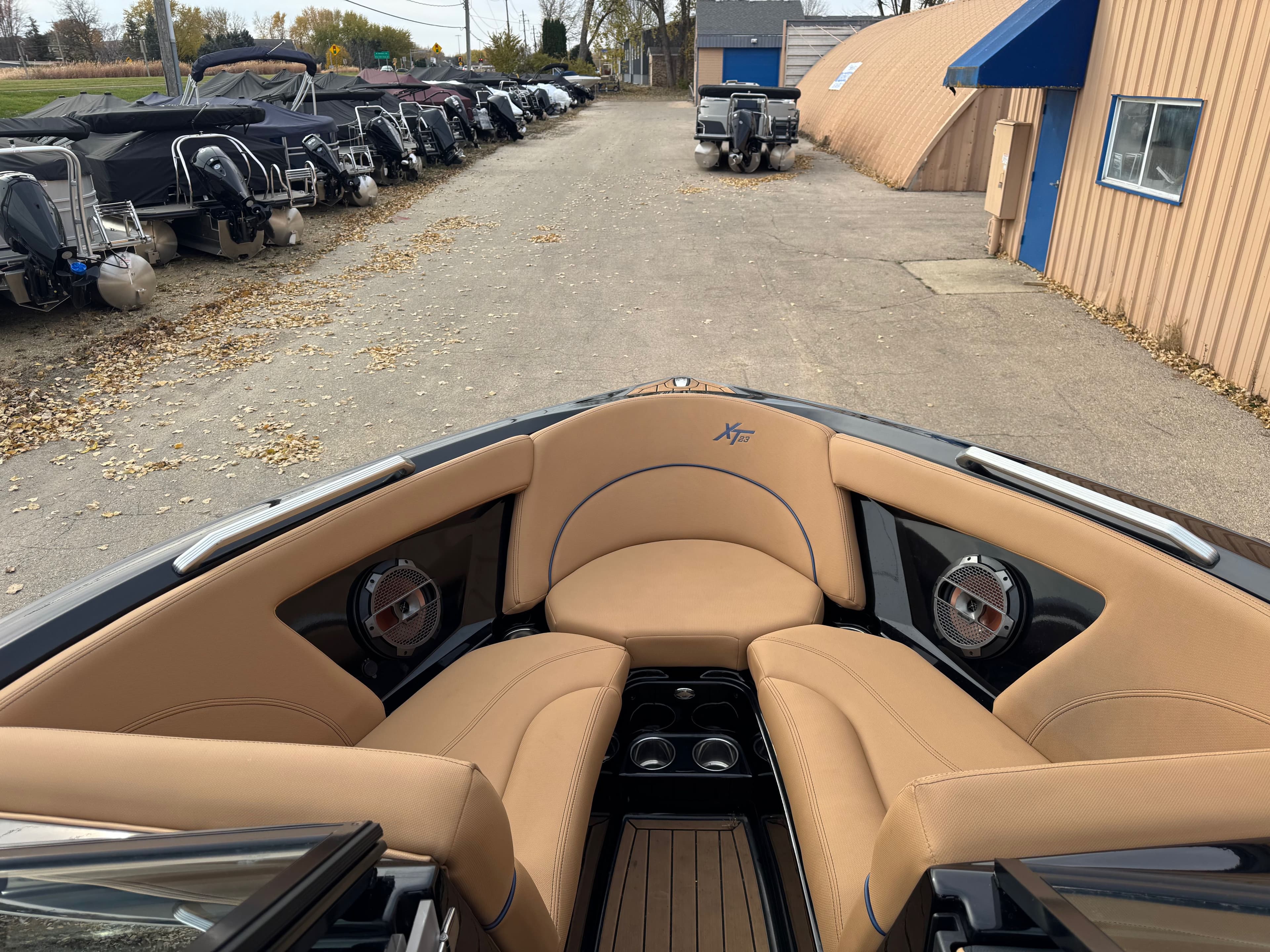 Interior of a 2021 MasterCraft XT23 boat with beige seating.