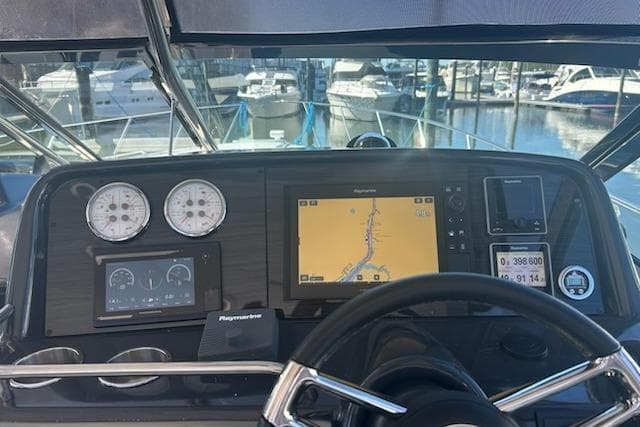 2018 Formula 40 Performance Cruiser dashboard with navigation and control instruments at marina.