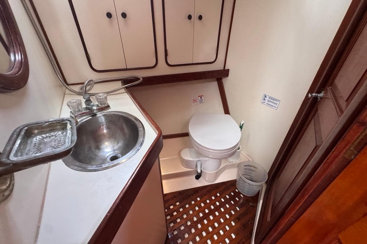 1981 Gulfstar 44 Mk II Center Cockpit Sloop bathroom with sink and toilet.