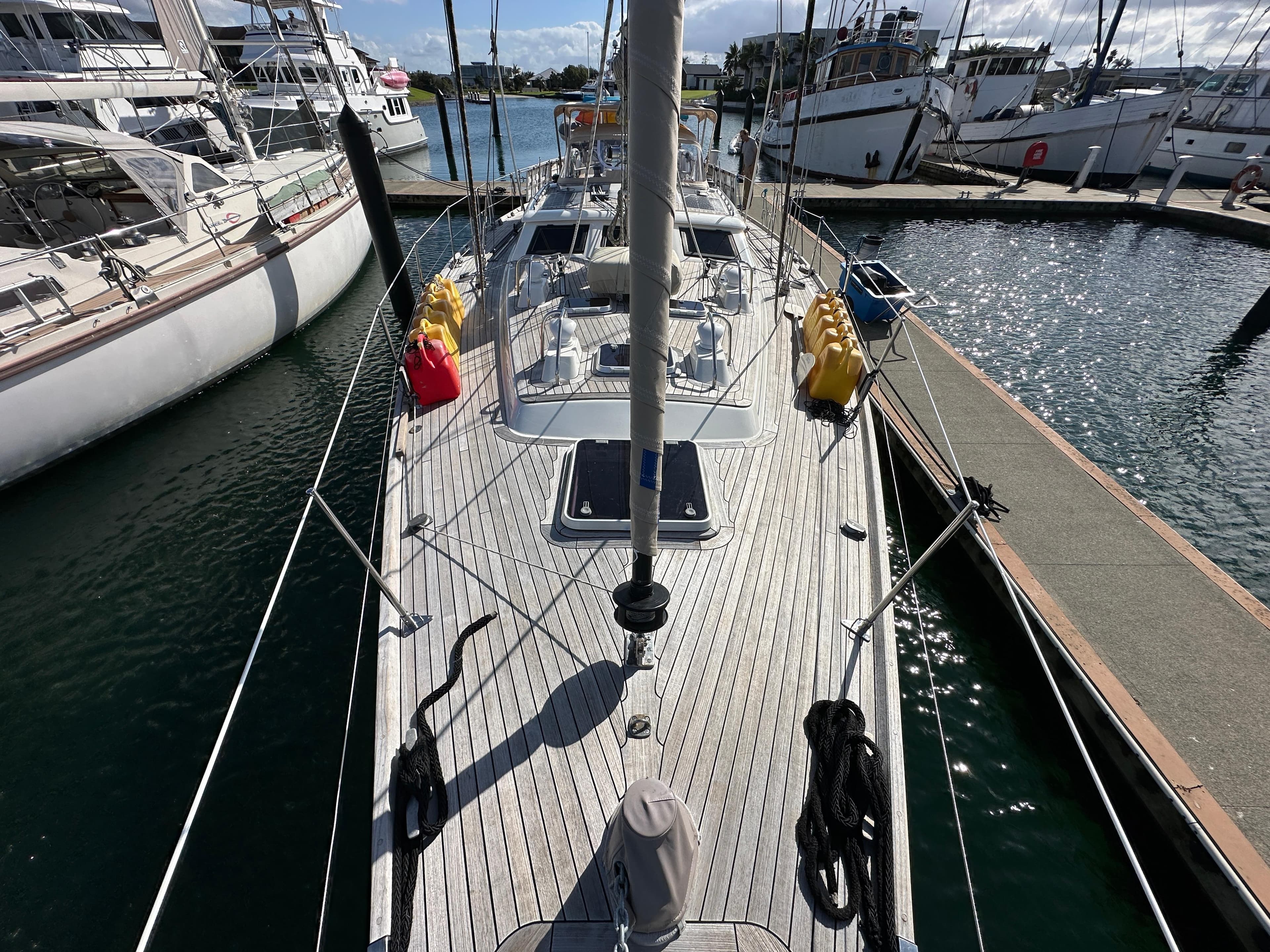Sailing yacht Oyster 55, 1994 model, docked at marina with clear skies.