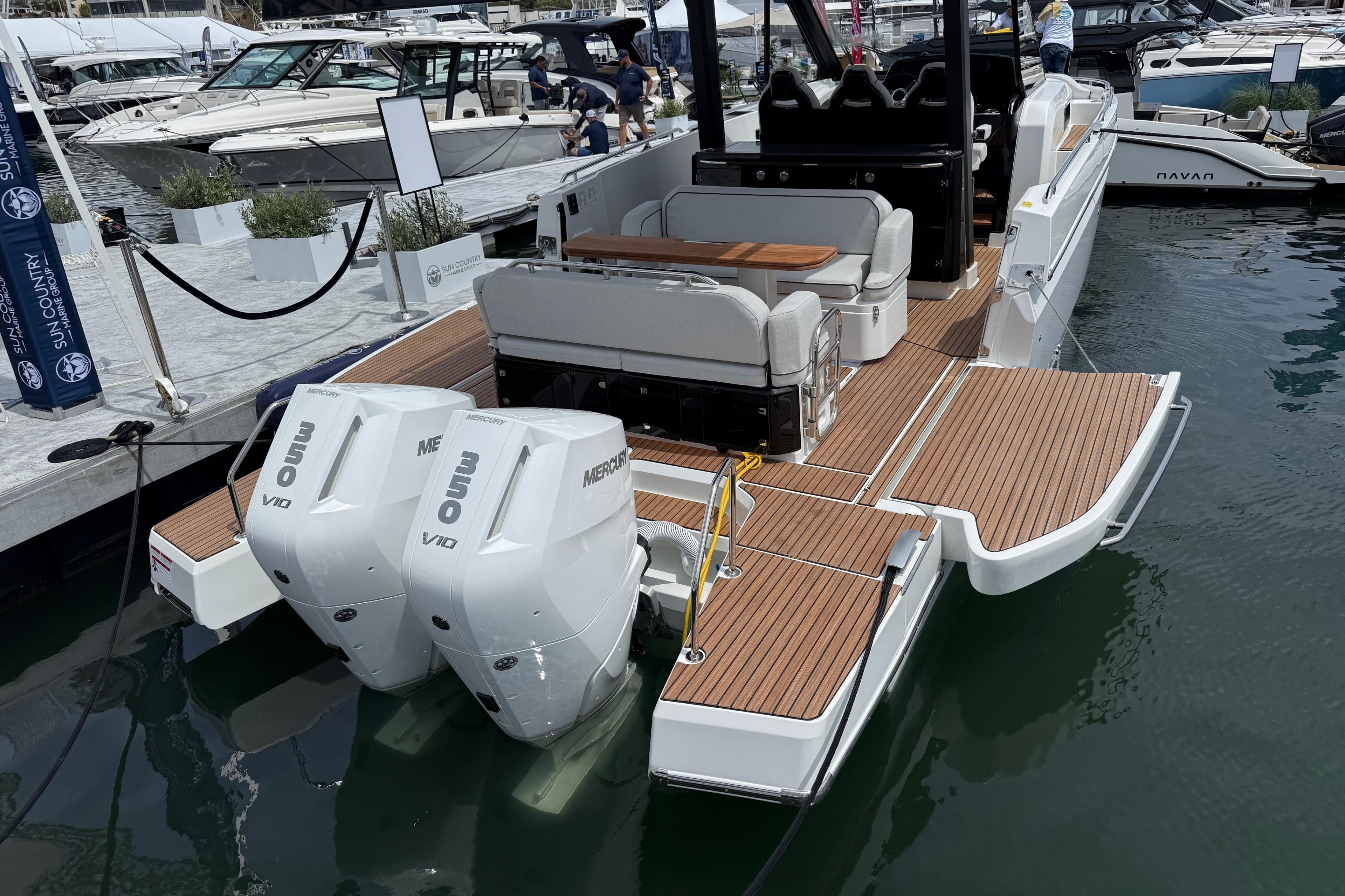 2026 Beneteau Gran Turismo 35 yacht with twin Mercury engines docked at marina.