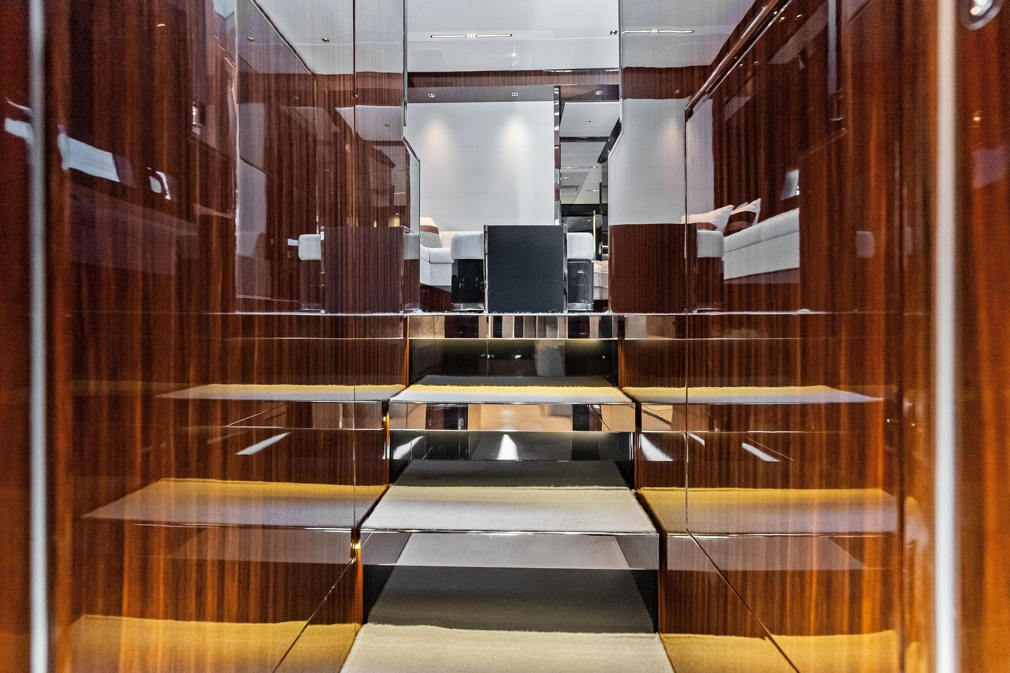 Luxurious interior of 2024 Riva 76 PERSEO Super yacht with polished wood finishes.