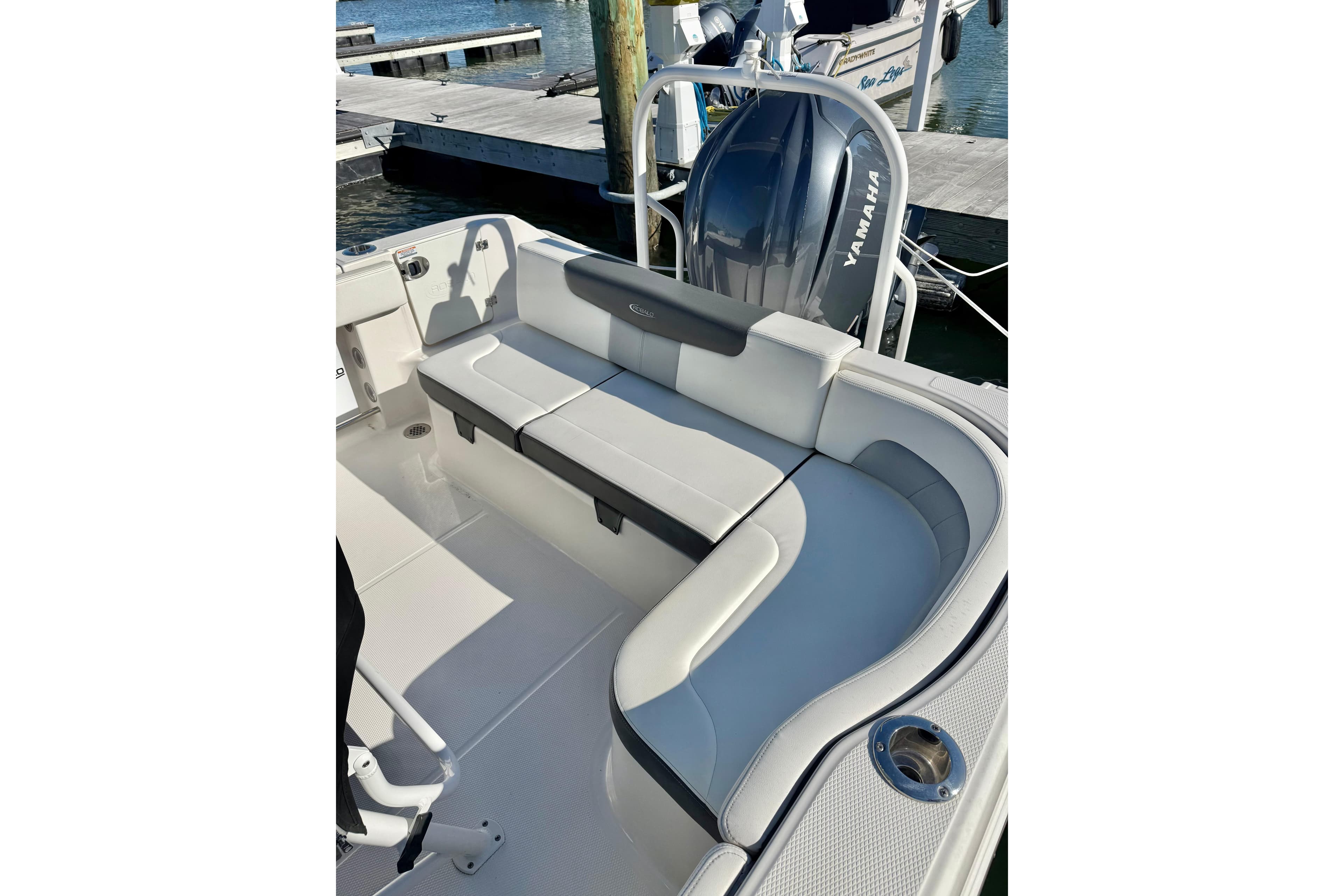 2022 Robalo R242 Explorer boat interior with cushioned seating and Yamaha engine.