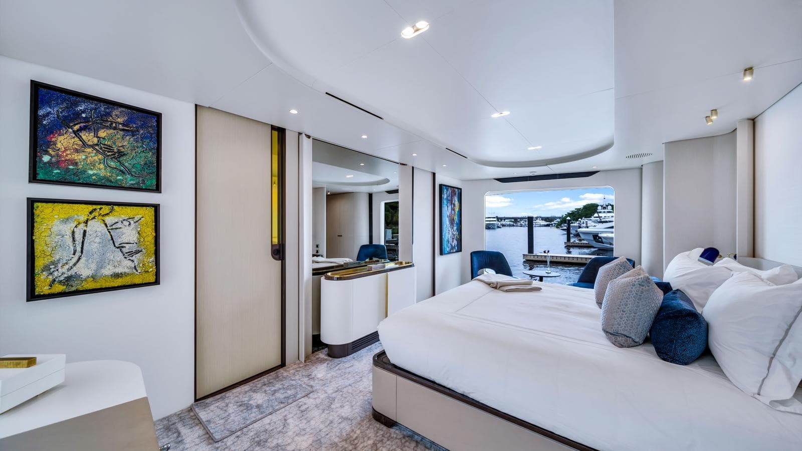 Luxurious bedroom interior of 2020 Azimut Grande 32 Metri yacht with modern decor.