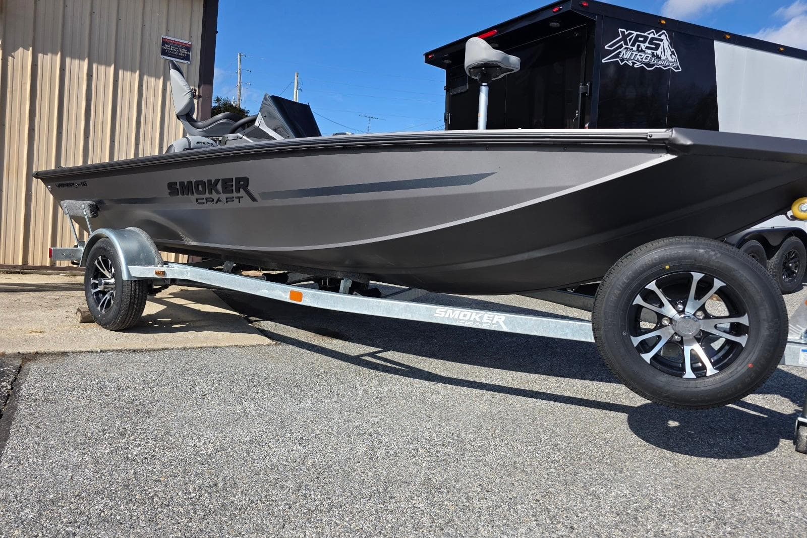 2026 Smoker Craft Viper 165 boat on trailer, parked outdoors.
