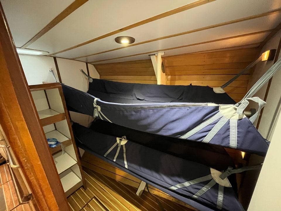 Interior of 1992 Devonport Challenge 67 yacht with bunk beds and wooden paneling.