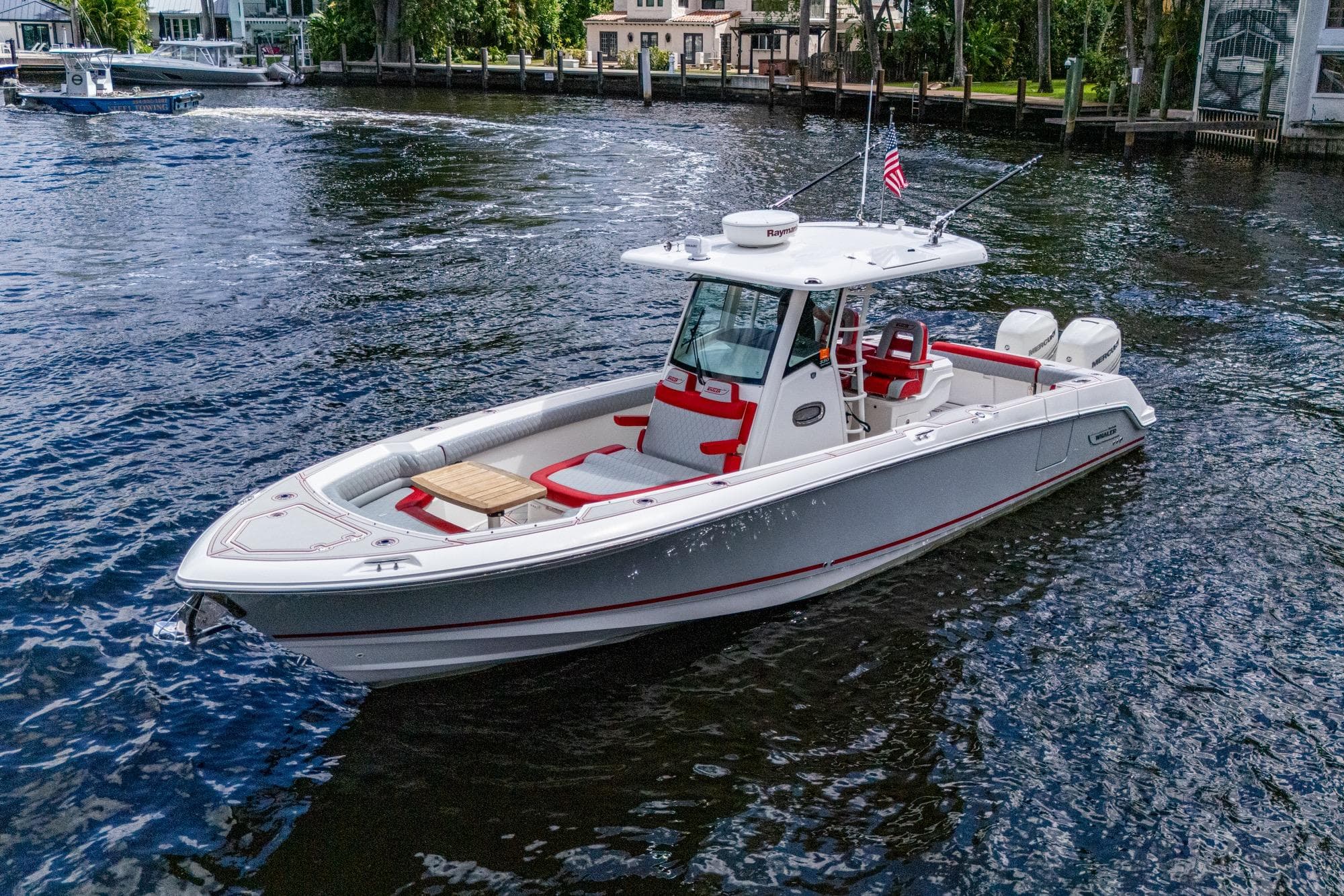 2018 Boston Whaler 330 boat on water, featuring sleek design and modern amenities.