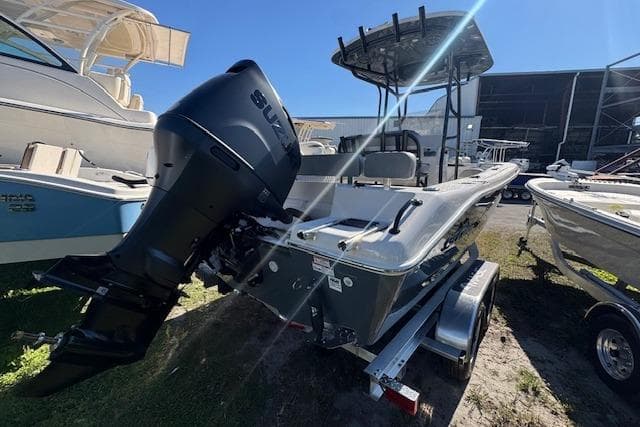 2026 Sea Chaser 22 HFC boat with Suzuki outboard motor, parked on a trailer.